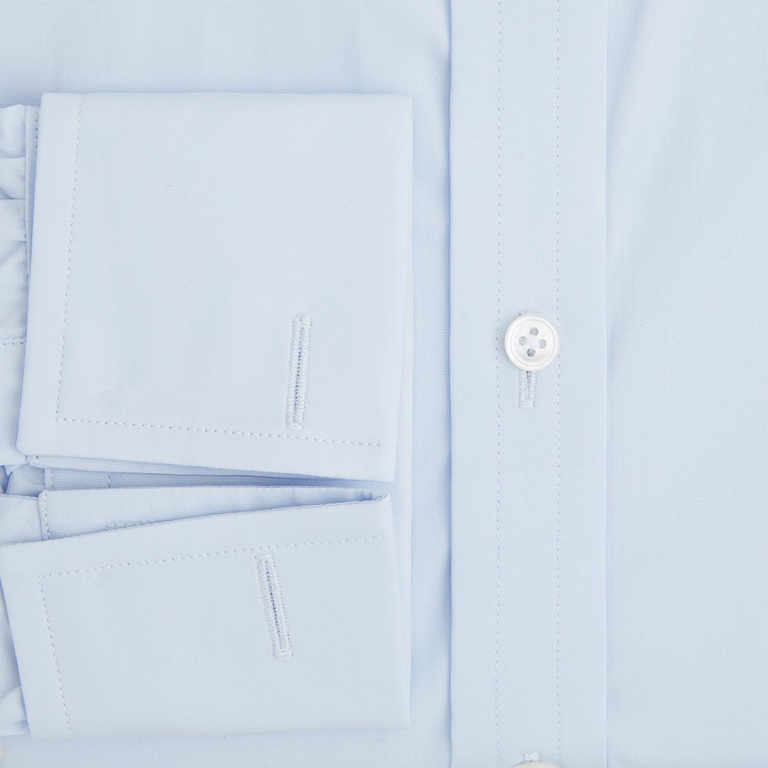 Image 4 of product The Turnbull & Asser Light Blue Mayfair Shirt features white buttons, a classic collar, and buttoned cuffs—styled flat on a white background, it’s ideal for minimalist outfits or pairing with bold ties.