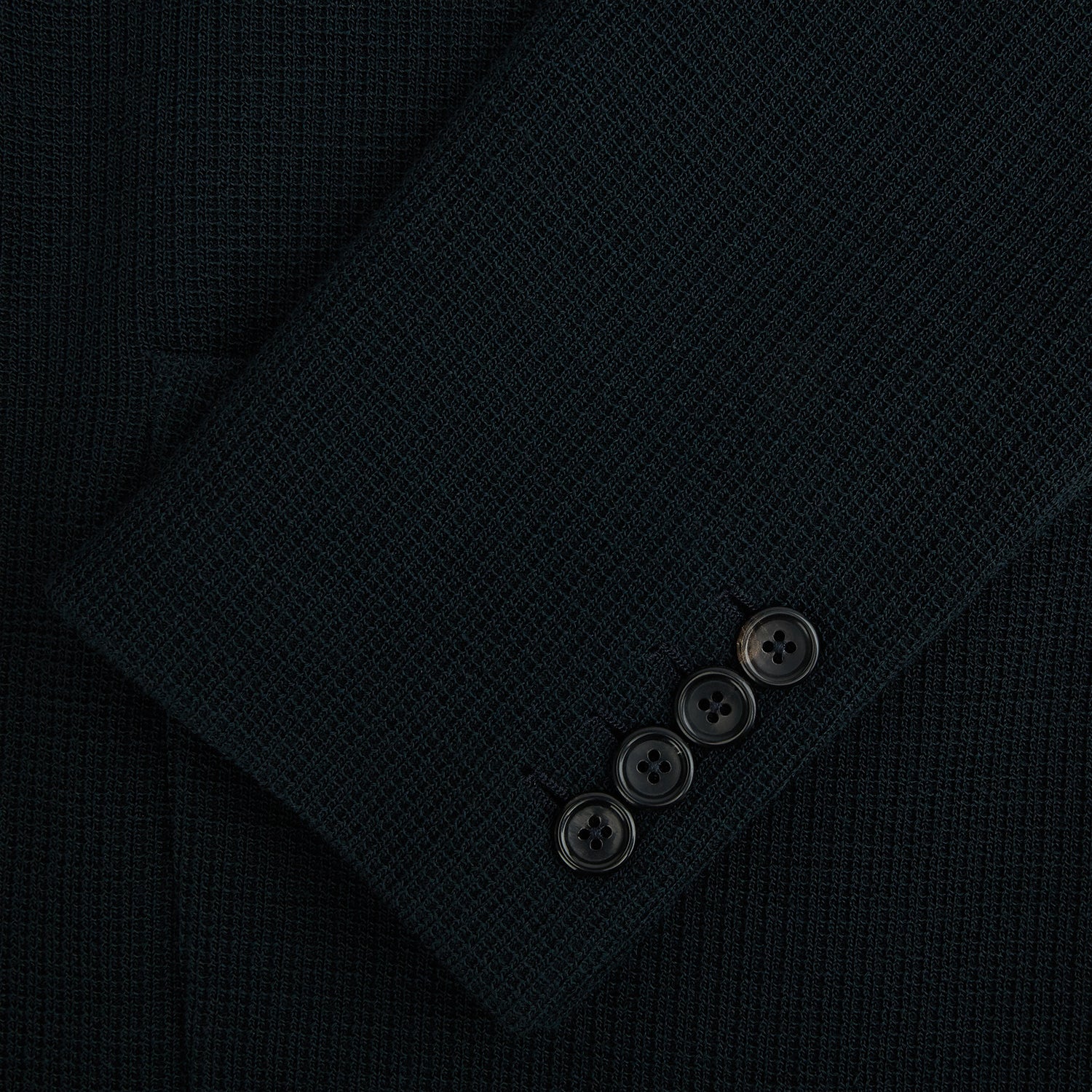 Image 4 of product The Forest Green KNITTED CAMBRIDGE BLAZER by Turnbull & Asser, crafted from textured Italian wool with notch lapels, patch and chest pockets, and two buttons, is shown against a plain white background.