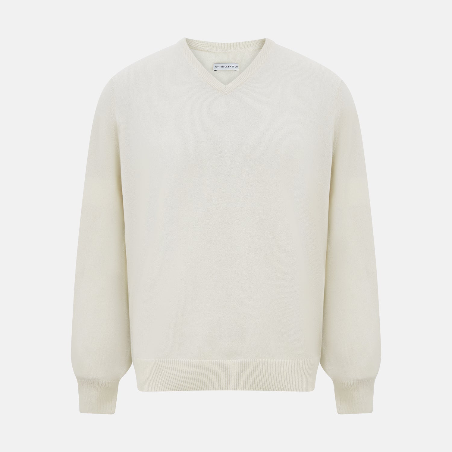 Image 1 of product The Turnbull & Asser White Cashmere V-Neck Jumper features long sleeves and a versatile light cream shade, making it a timeless addition to your knitwear collection.
