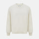 The Turnbull & Asser White Cashmere V-Neck Jumper features long sleeves and a versatile light cream shade, making it a timeless addition to your knitwear collection.