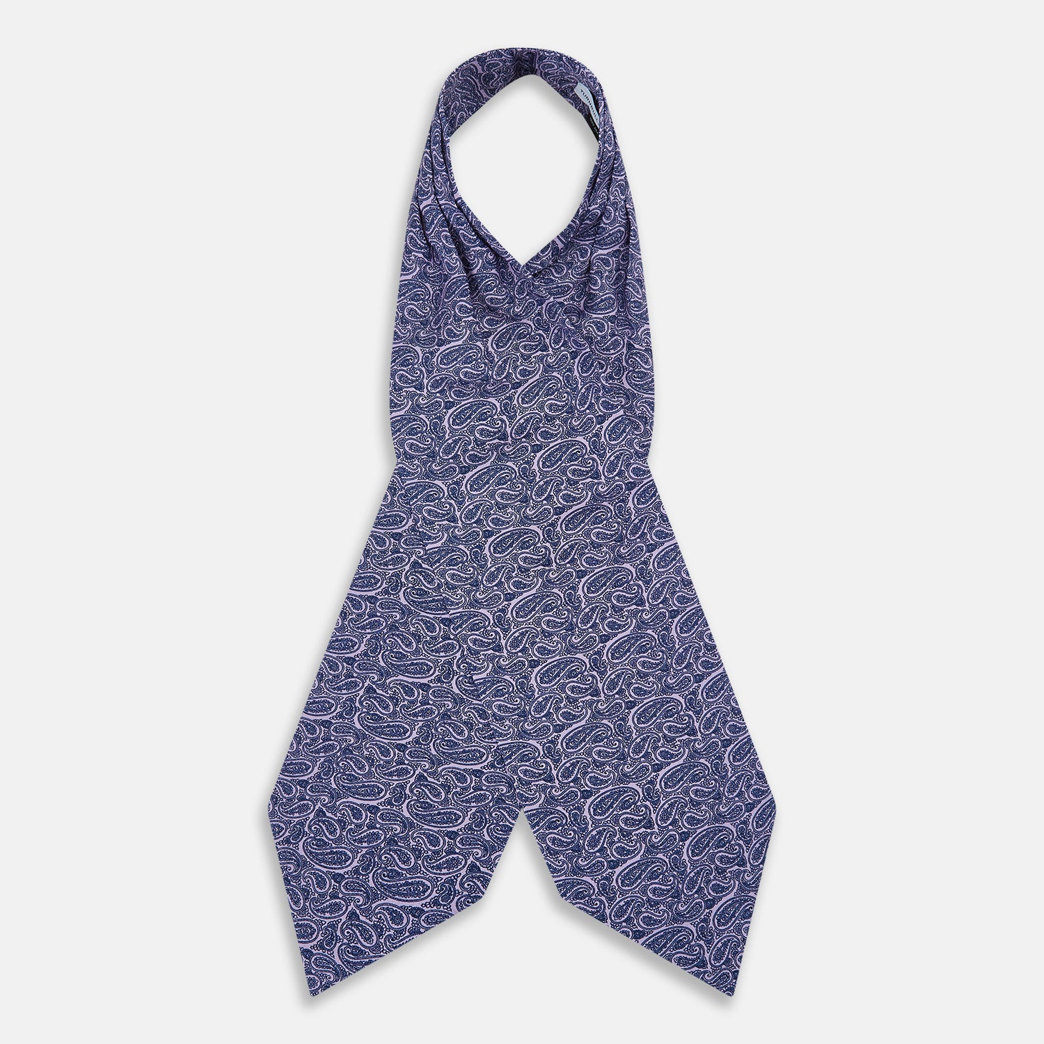 Image 2 of product The Turnbull & Asser Lilac Paisley Silk Cravat showcases British elegance with its dark blue paisley pattern on a lilac background, beautifully displayed on a white surface.