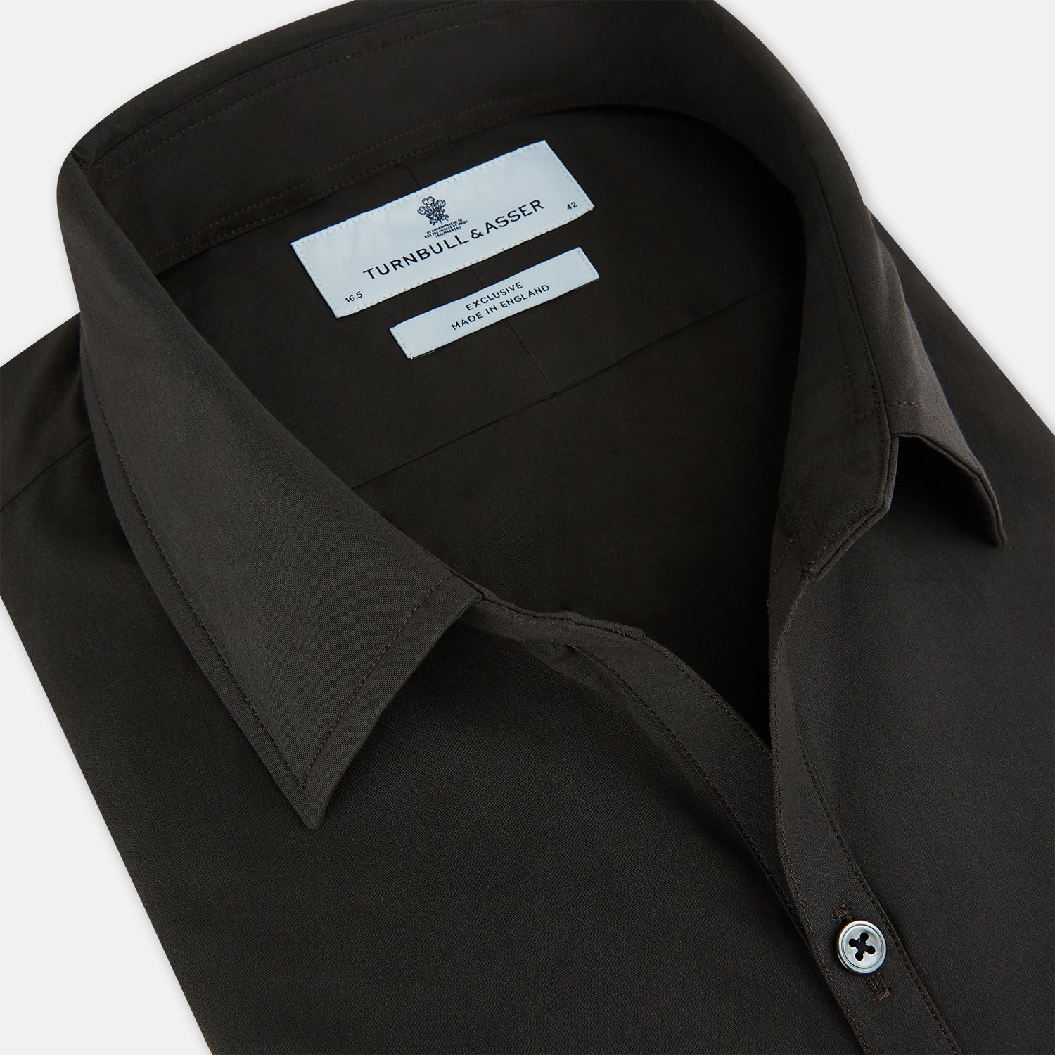 Image 2 of product A brown Windsor long-sleeve button-up shirt by Turnbull & Asser with a classic collar, buttoned cuffs, and a straight hem, laid flat on a white background—showcasing refined British craftsmanship.