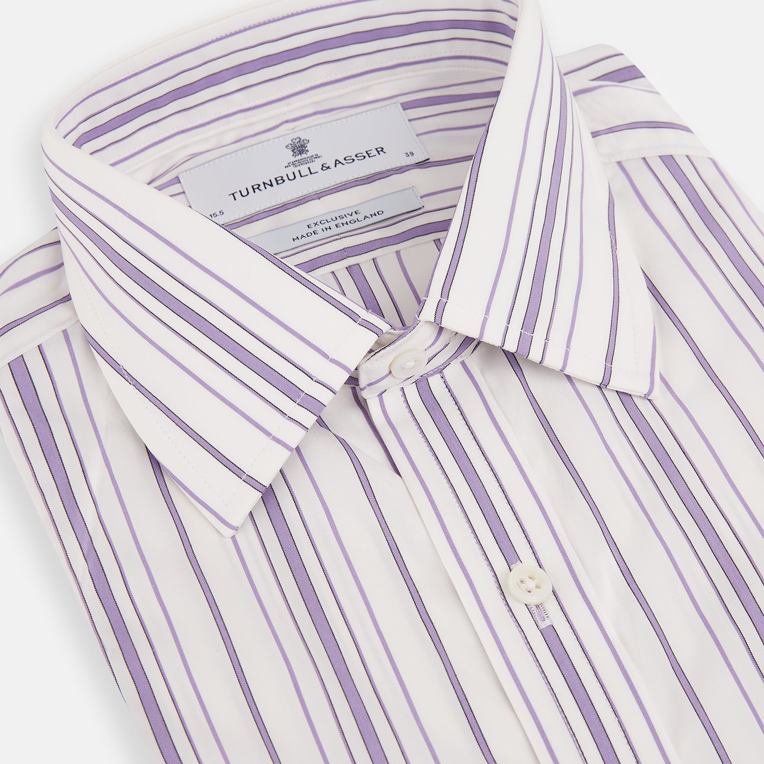 Image 2 of product The Purple Multi Stripe Mayfair Shirt by Turnbull & Asser is a long-sleeve, collared button-up featuring vertical blue and purple stripes on white, ideal for formal occasions. The shirt is neatly displayed flat against a white background.