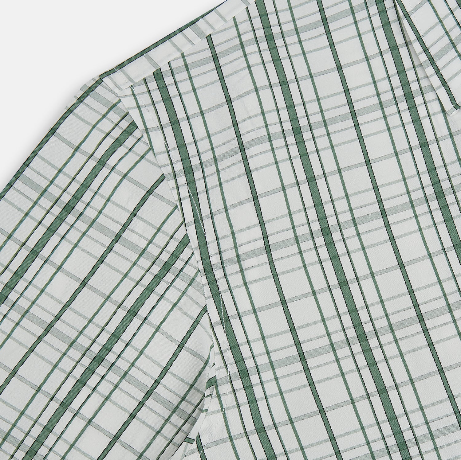 Image 6 of product The Turnbull & Asser Sage Green Plaid Check Westminster Shirt features a collared, long-sleeve button-up design with a white base and sage green plaid pattern, showcasing classic British craftsmanship against a clean white background.