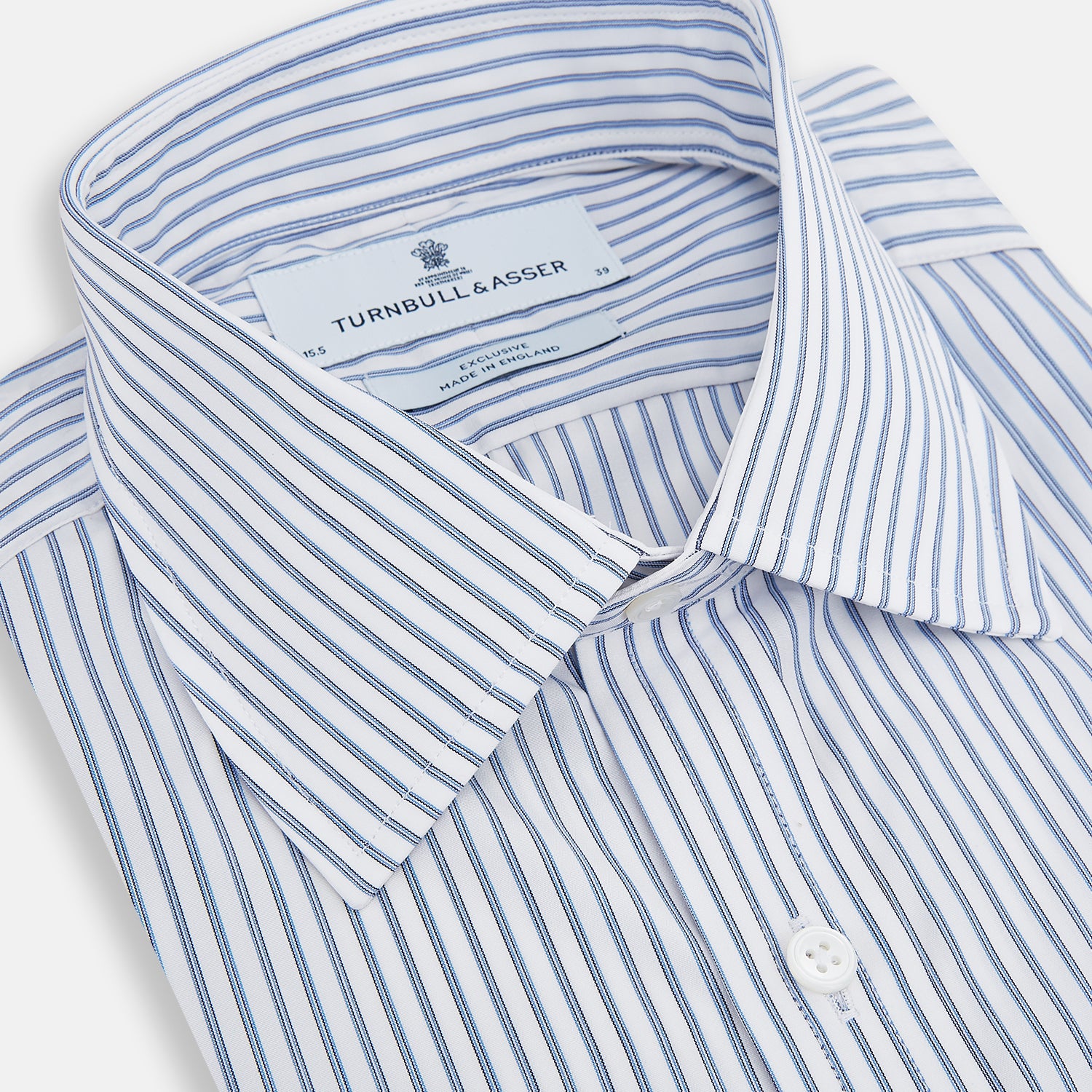 Image 2 of product The Turnbull & Asser Navy Double Pinstripe Mayfair Shirt is a long-sleeve, button-up collared shirt with thin vertical blue and white stripes, shown against a plain white background.