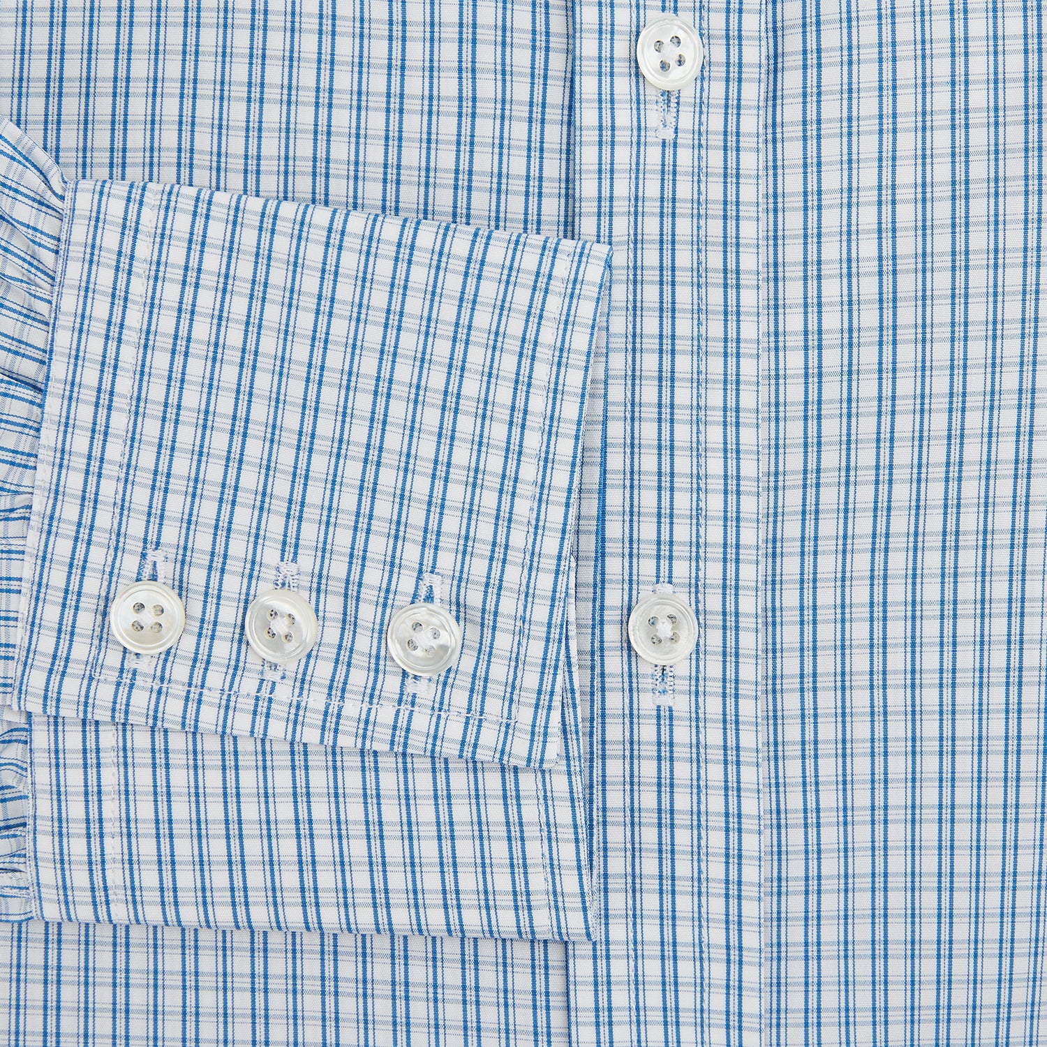 Image 4 of product The Sky Blue Micro Graph Check Mayfair Shirt by Turnbull & Asser features a classic T&A collar, button-down front, and buttoned cuffs, shown laid flat on a white background.