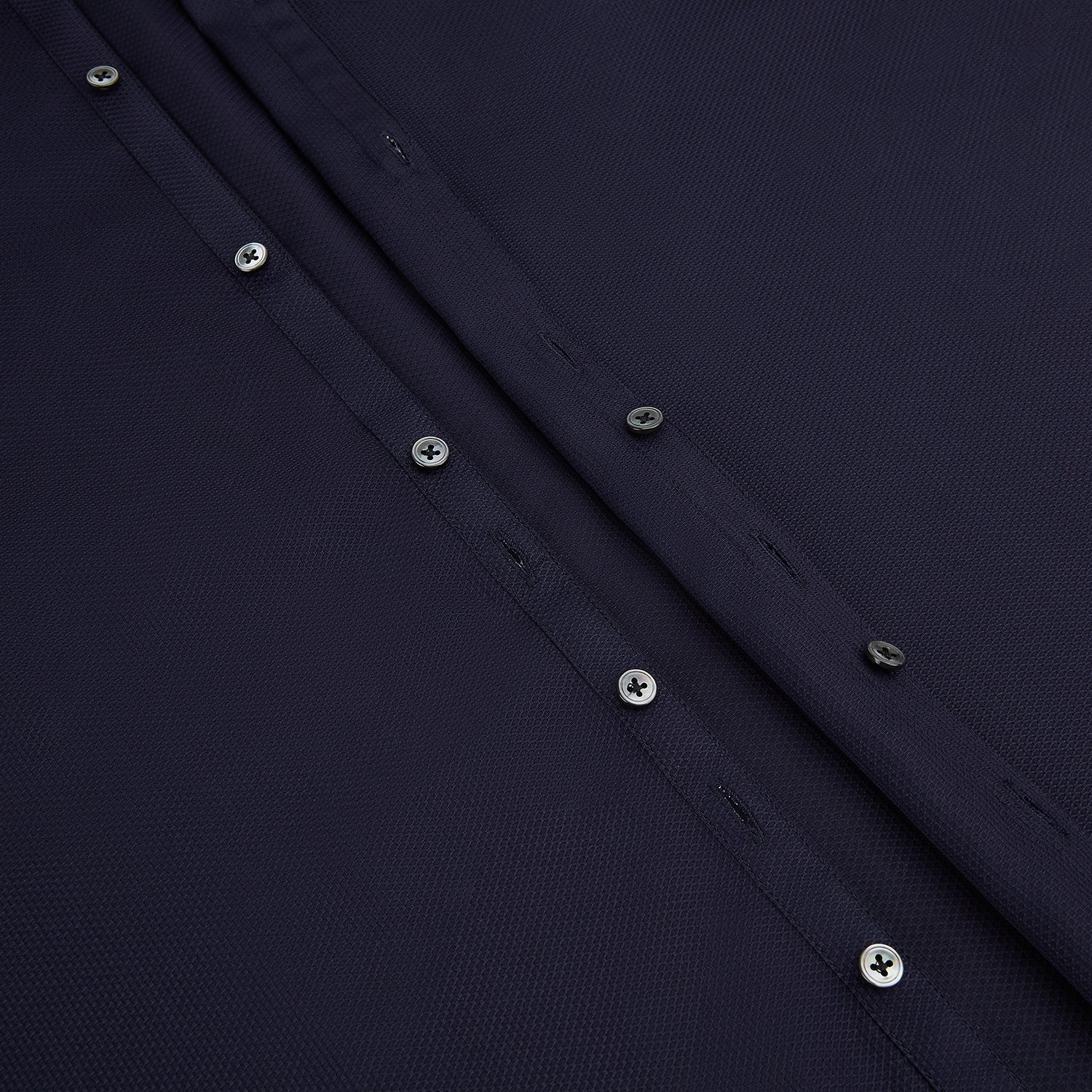 Image 7 of product The Navy Textured Windsor Shirt by Turnbull & Asser features long sleeves, a Windsor collar, buttoned cuffs, and white buttons—a fine example of British craftsmanship—set against a plain white background.
