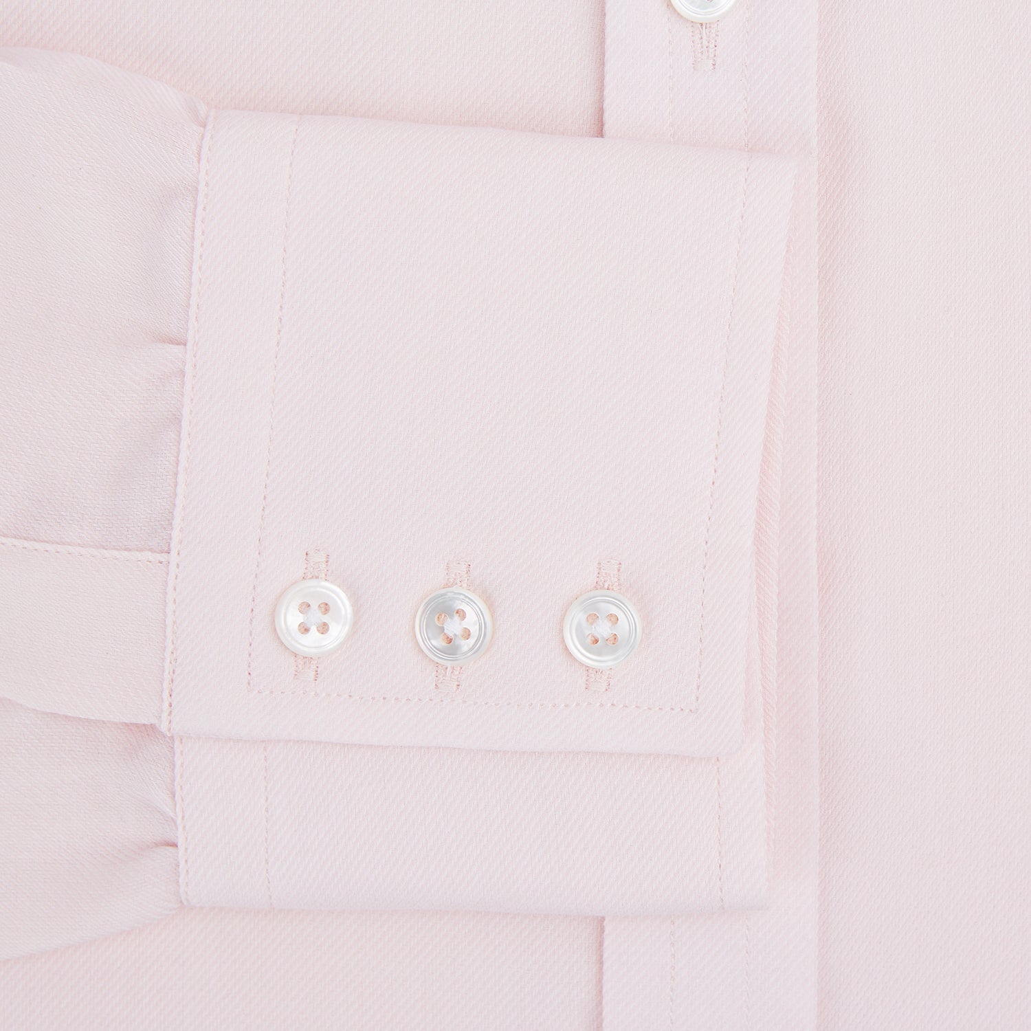 Image 4 of product The Pale Pink Cotton Cashmere Mayfair Shirt by Turnbull & Asser features a classic collar, button-down front, and buttoned cuffs, crafted from a luxurious cotton-cashmere blend and displayed flat on a white background.