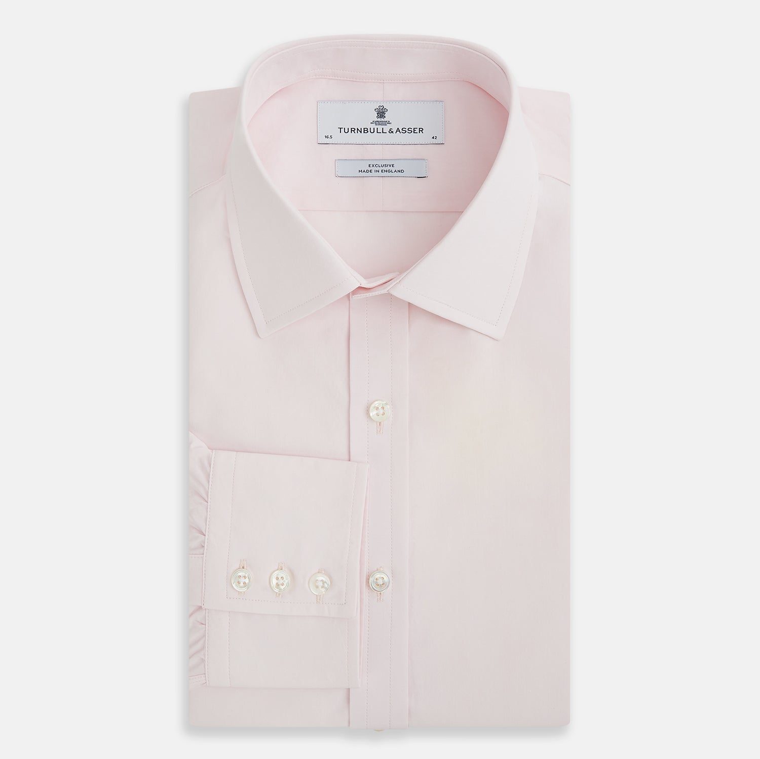 Image 5 of product The Soft Pink Mayfair Shirt by Turnbull & Asser is a long-sleeved, sanforised cotton button-up with a classic collar, white buttons, and buttoned cuffs, shown against a plain white background.