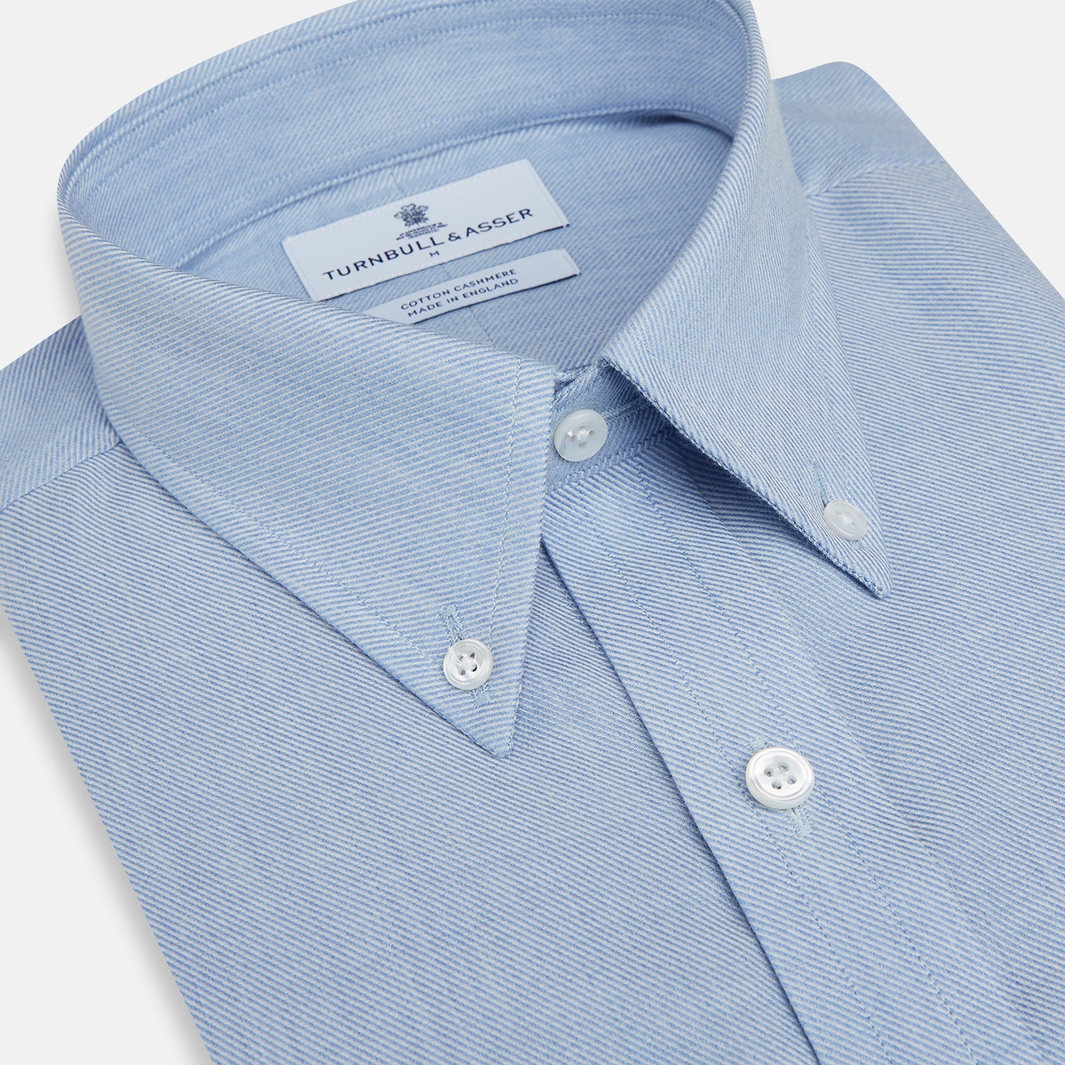 Image 2 of product The Turnbull & Asser Pale Blue Cotton Cashmere Dorset Collar Richmond Shirt features long sleeves, a button-down collar, white buttons, and a chest pocket. It is neatly displayed flat on a white background.