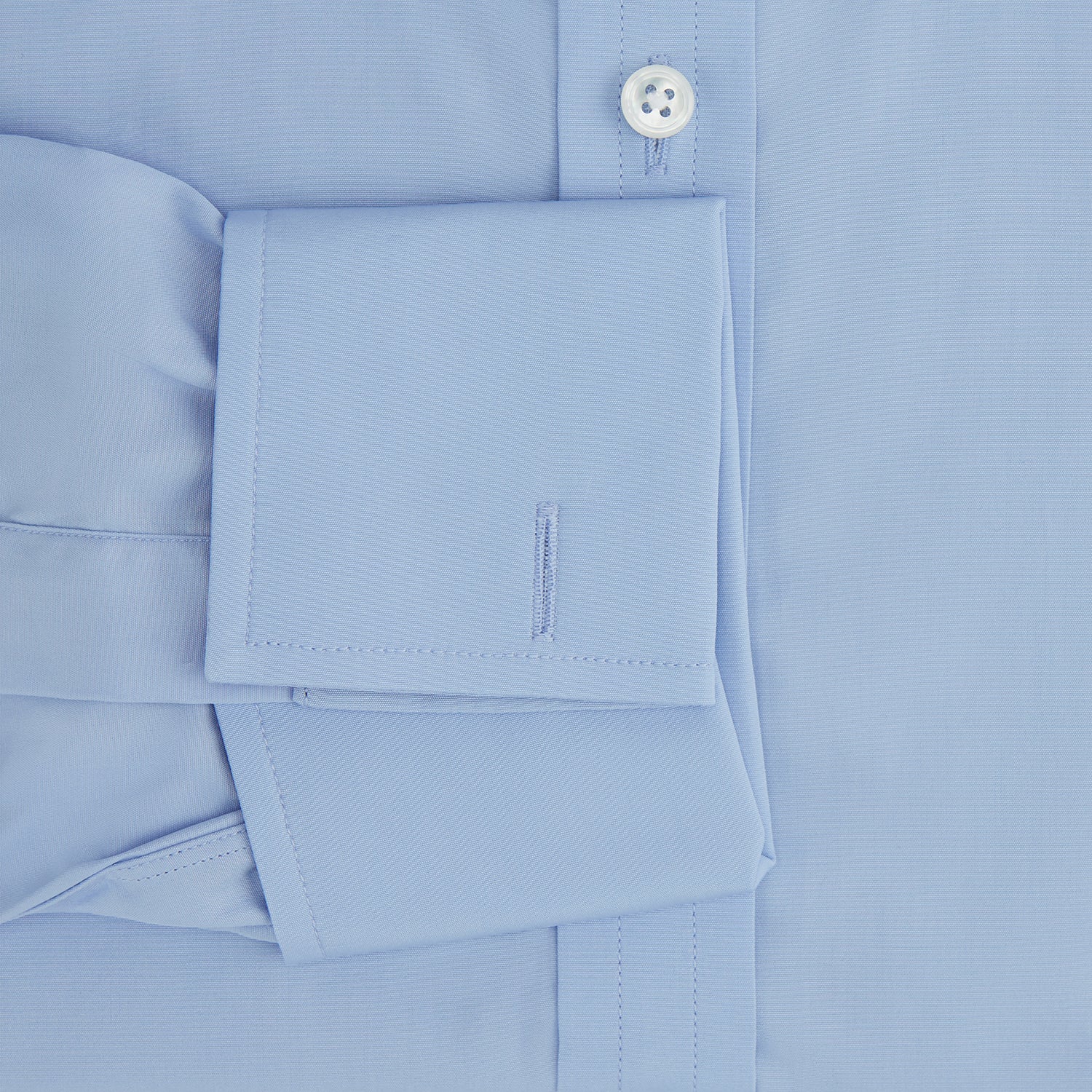 Image 4 of product The Turnbull & Asser Blue Cotton Shirt features a T&A collar, double cuffs, and white buttons—ideal for smart styling with a navy suit. Displayed on a white background.