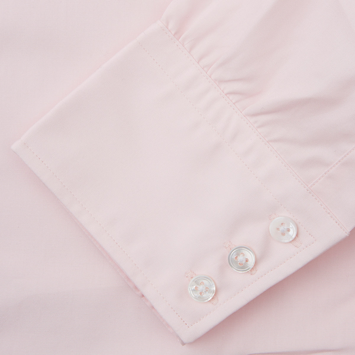 Image 3 of product The Turnbull & Asser Pink Cotton Shirt features a T&A collar, 3-button cuffs, and a clean-cut design, displayed neatly folded against a plain white background.