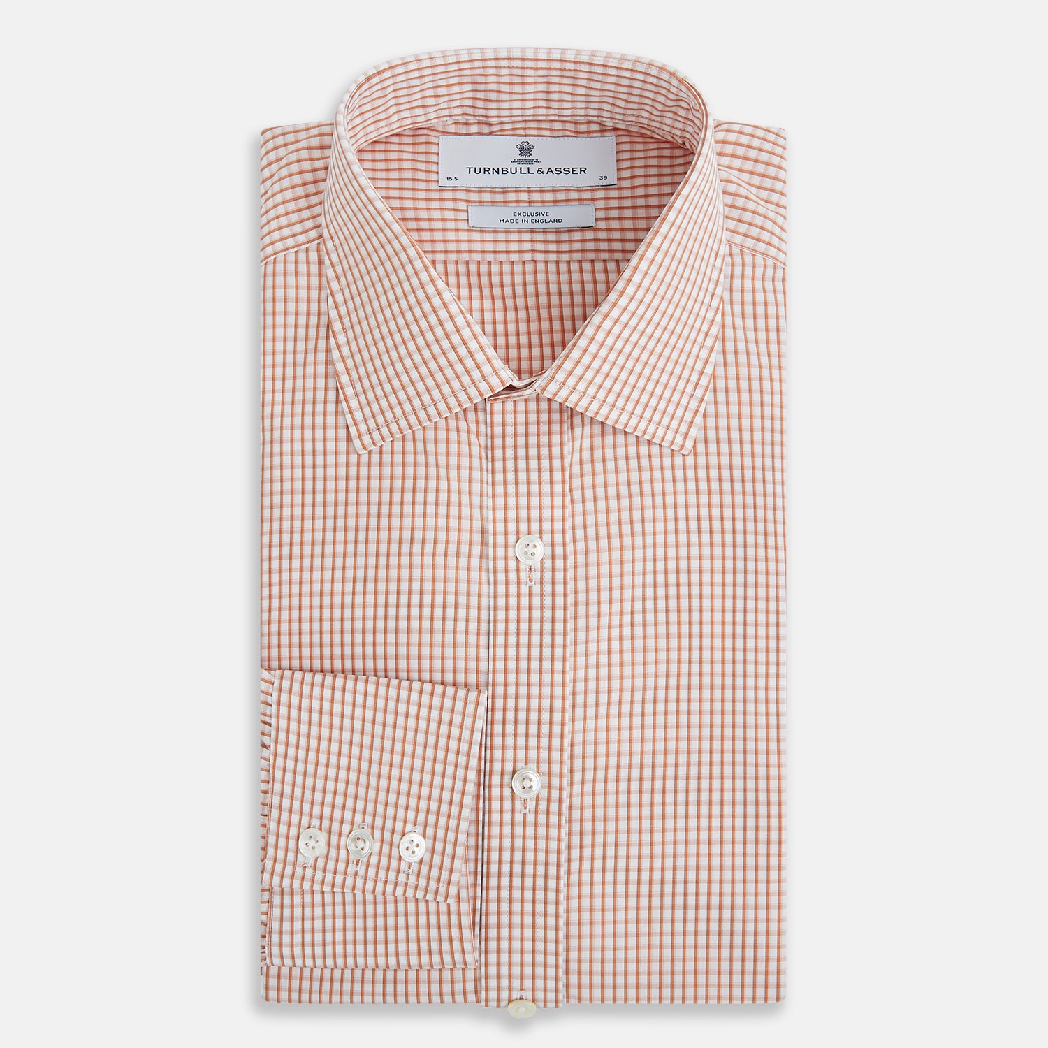 Image 5 of product The Orange Micro Shadow Check Mayfair Shirt by Turnbull & Asser features a T&A collar, button-down front, and buttoned cuffs; crafted from Italian cotton in an orange and white check pattern, laid flat on a white background.
