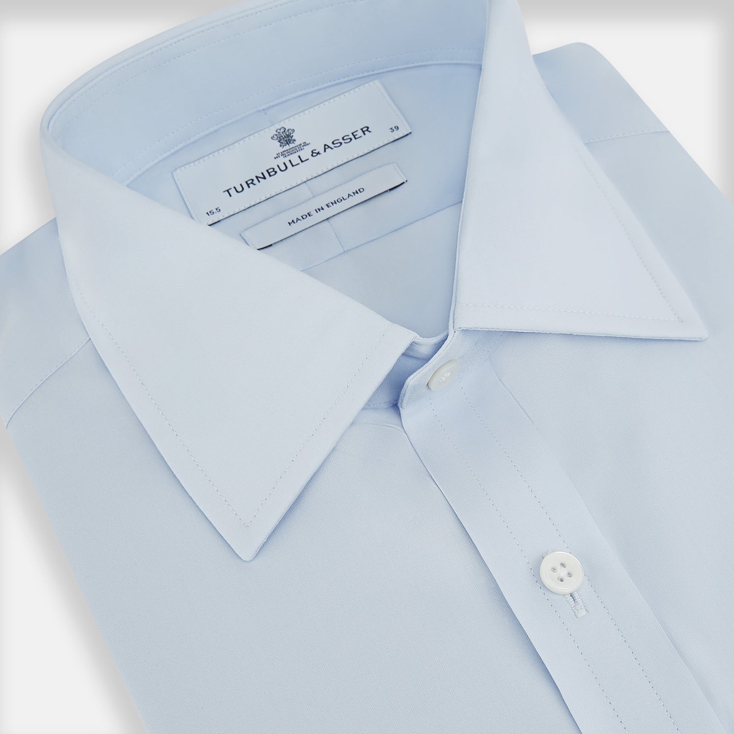 Image 2 of product The Turnbull & Asser Pale Blue Cotton Regular Fit Mayfair Shirt features a classic collar, white buttons, and buttoned cuffs. This long-sleeve dress shirt displays the timeless Mayfair silhouette for a refined look.