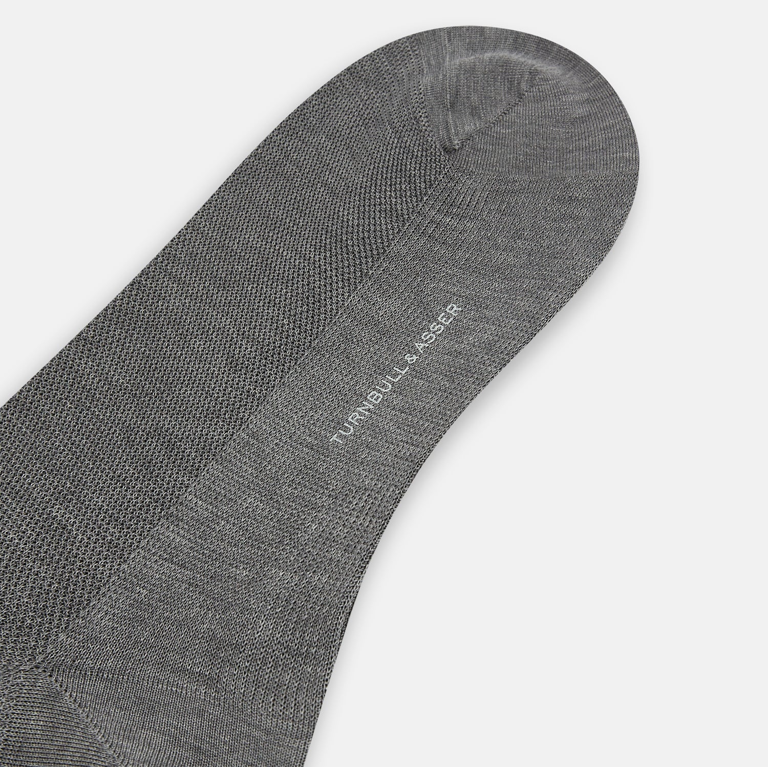 Image 3 of product A single Steel Melange Micro Knit Mid-Length Sock by Turnbull & Asser, knee-high and gray, crafted from mercerised Egyptian cotton with a subtle micro knit pattern, is displayed upright on a plain white background.