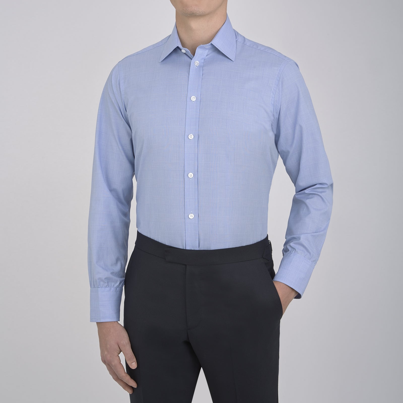 Image 5 of product A Blue Prince of Wales Check Shirt by Turnbull & Asser, featuring a T&A collar and 3-button cuffs, is neatly folded and displayed on a plain white background.