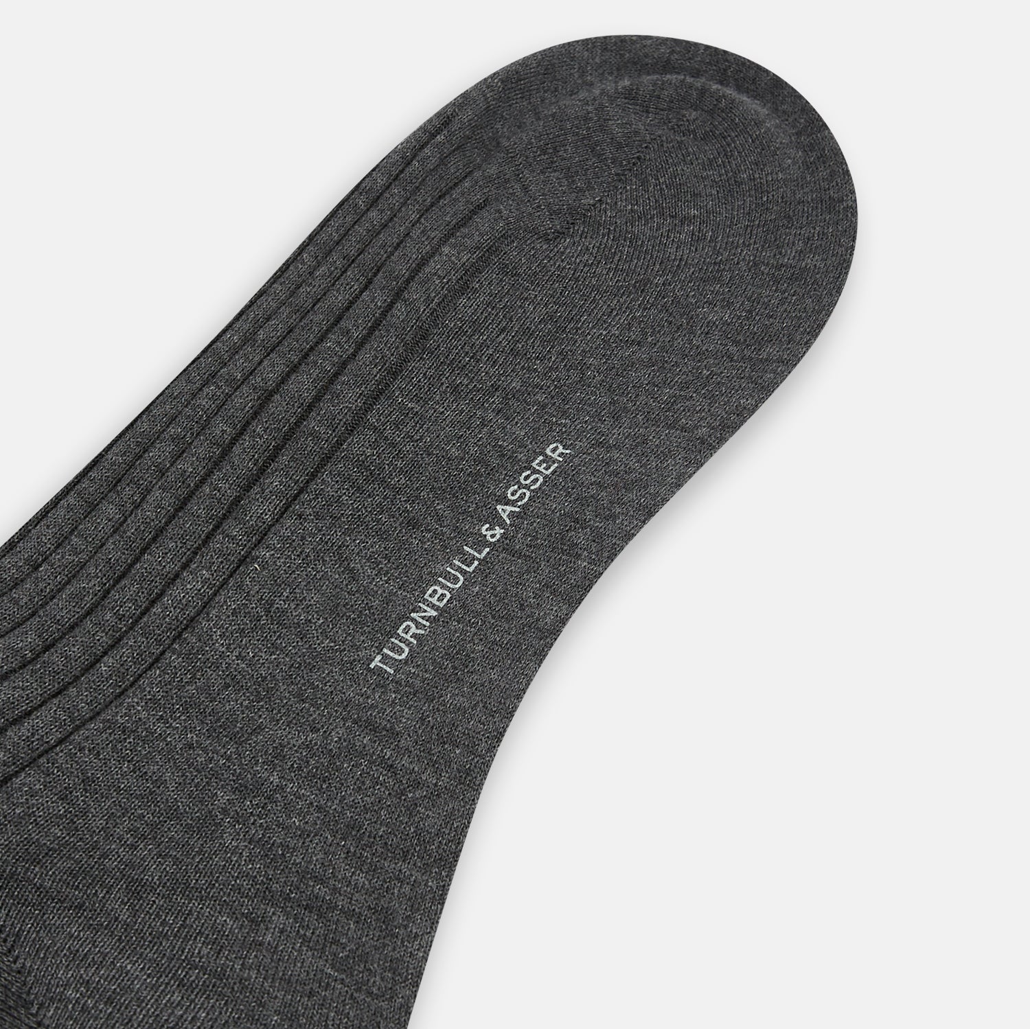 Image 3 of product A single Grey Organic Cotton Mid-Length Sock by Turnbull & Asser is shown upright on a white background, featuring a ribbed texture and reinforced cuff.