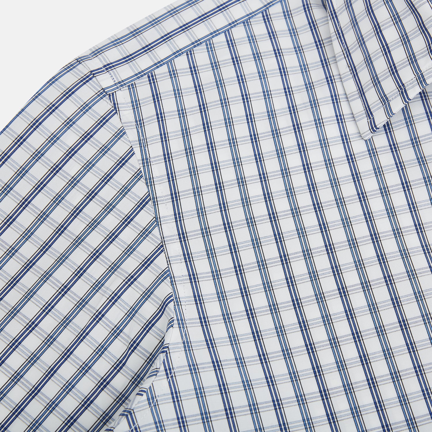Image 6 of product The Azzurro Multi Check Westminster Shirt by Turnbull & Asser is a long-sleeve, button-up with a white base and blue and gray checks, displayed flat against a white background.