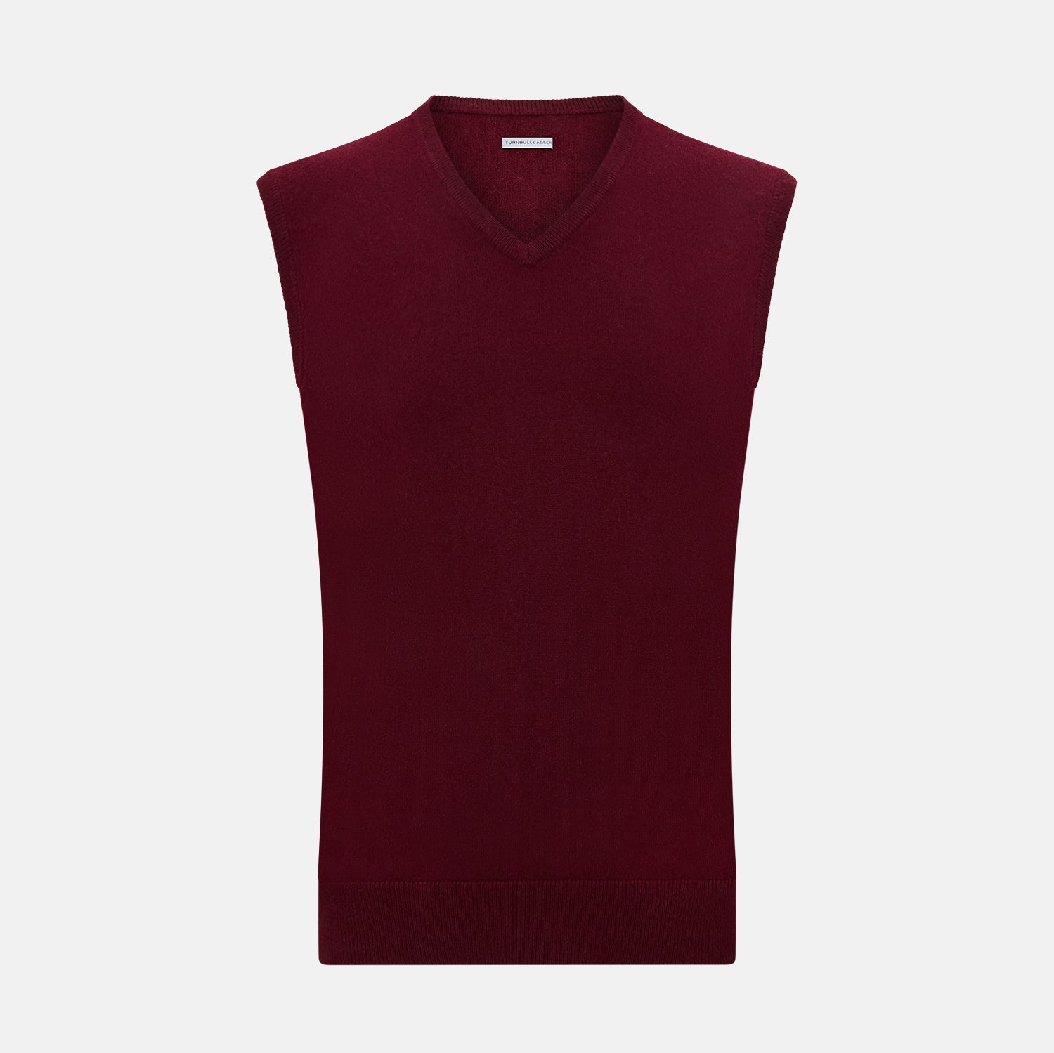 Image 1 of product The Turnbull & Asser Burgundy Cashmere V-Neck Vest for men is a stylish, sleeveless knit sweater displayed on a plain white background.