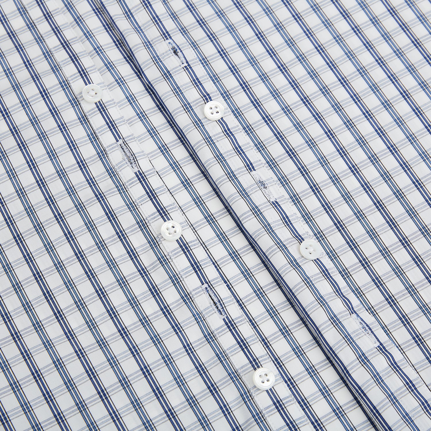 Image 7 of product The Azzurro Multi Check Westminster Shirt by Turnbull & Asser is a long-sleeve, button-up with a white base and blue and gray checks, displayed flat against a white background.