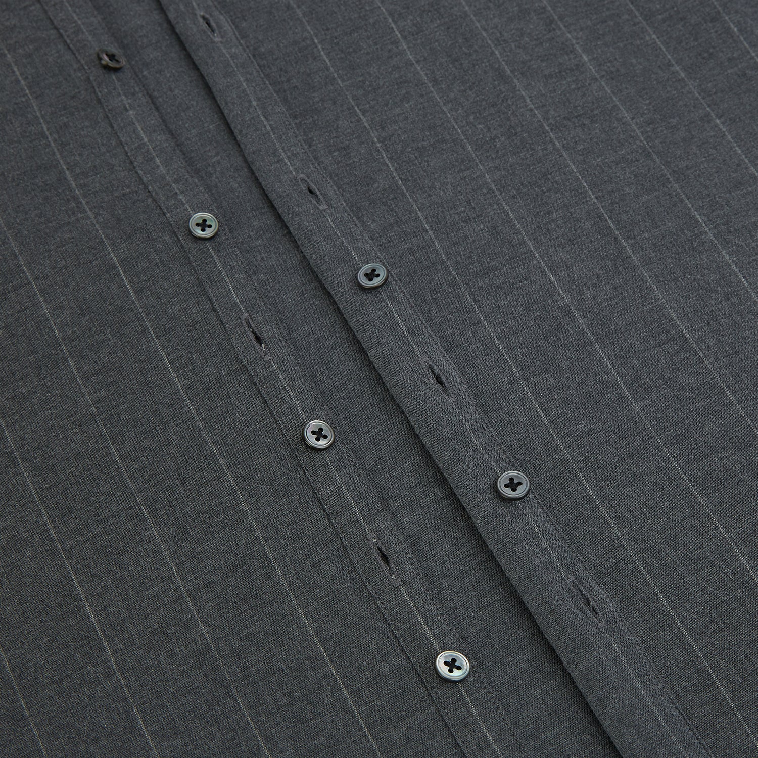 Image 7 of product The Charcoal Melange Wide Stripe Westminster Shirt from Turnbull & Asser features long sleeves, a tailored fit, pointed collar, buttoned cuffs, and subtle wide stripes, shown laid flat on a white background.