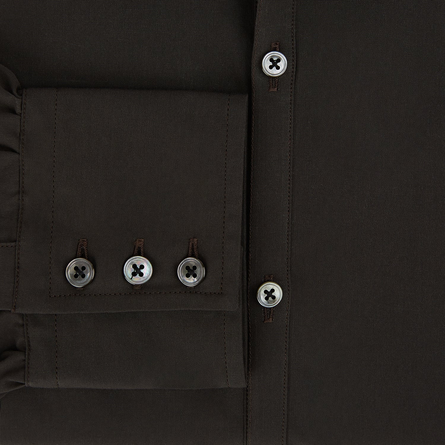 Image 4 of product A brown Windsor long-sleeve button-up shirt by Turnbull & Asser with a classic collar, buttoned cuffs, and a straight hem, laid flat on a white background—showcasing refined British craftsmanship.