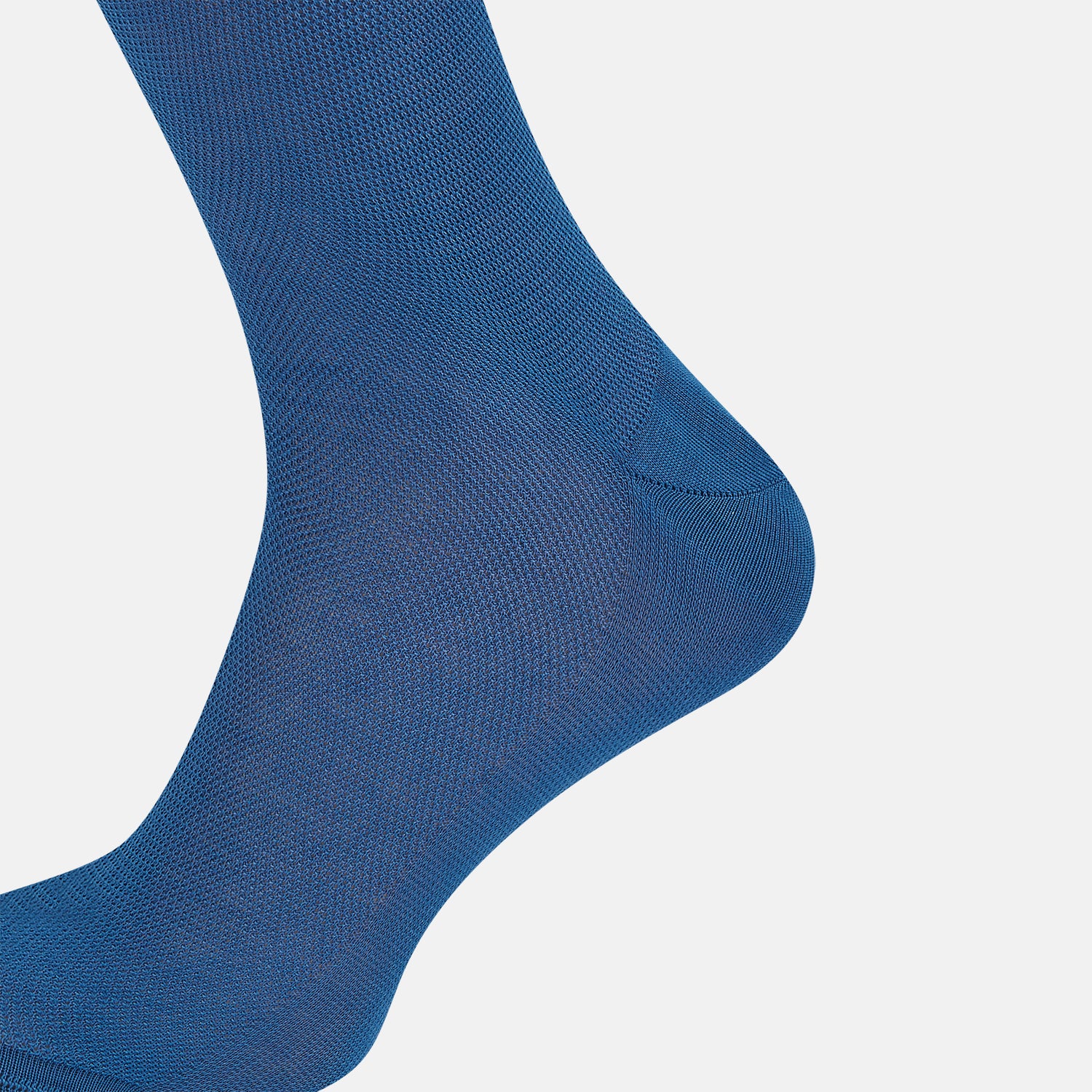 Image 4 of product The Azzurro Micro Knit Mid-Length Sock by Turnbull & Asser, crafted from mercerised Egyptian cotton, is shown upright on a light background with a smooth texture, micro knit pattern, and slightly ribbed top band.
