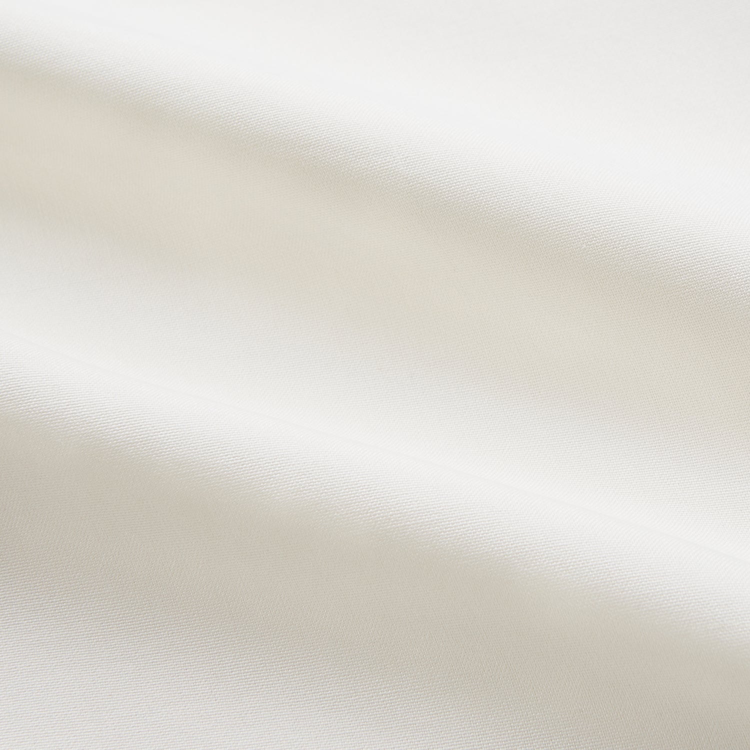 Image 5 of product The Cream Silk Whitby Shirt by Turnbull & Asser features a pointed collar, buttoned front and cuffs, and long sleeves, shown in Whitby Fit and laid flat on a white background.