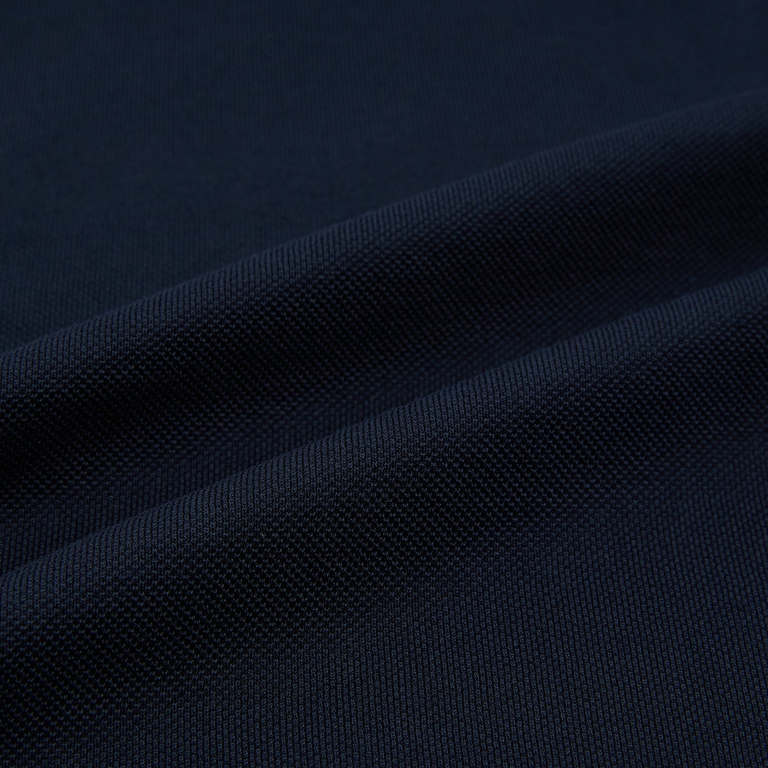 Image 5 of product The Turnbull & Asser Navy Polo Shirt features short sleeves, a collar, three-button placket, and a single buttoned chest pocket, shown flat on a plain white background.