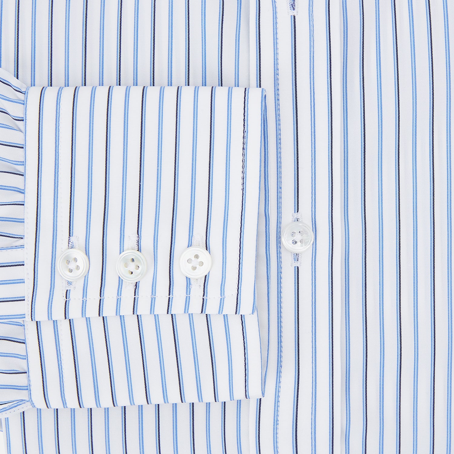 Image 4 of product The Blue and Navy Double Stripe Mayfair Shirt by Turnbull & Asser features a classic T&A collar and thin blue stripes on a white background, displayed against a plain white surface.