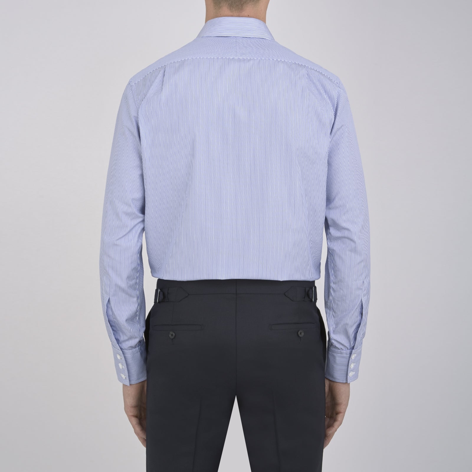 Image 6 of product The Turnbull & Asser Blue Fine Bengal Stripe Shirt features a classic T&A collar, 3-button cuffs, and white buttons, crafted from fine cotton and displayed against a crisp white background.