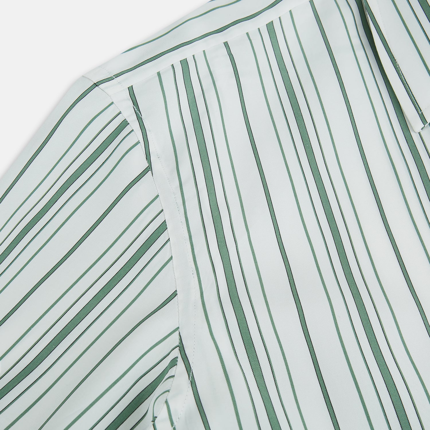 Image 6 of product The SAGE GREEN MULTI STRIPE WESTMINSTER SHIRT by Turnbull & Asser features a classic collar, long sleeves, buttoned cuffs, relaxed fit, and vertical green and white stripes—embodying timeless British craftsmanship.