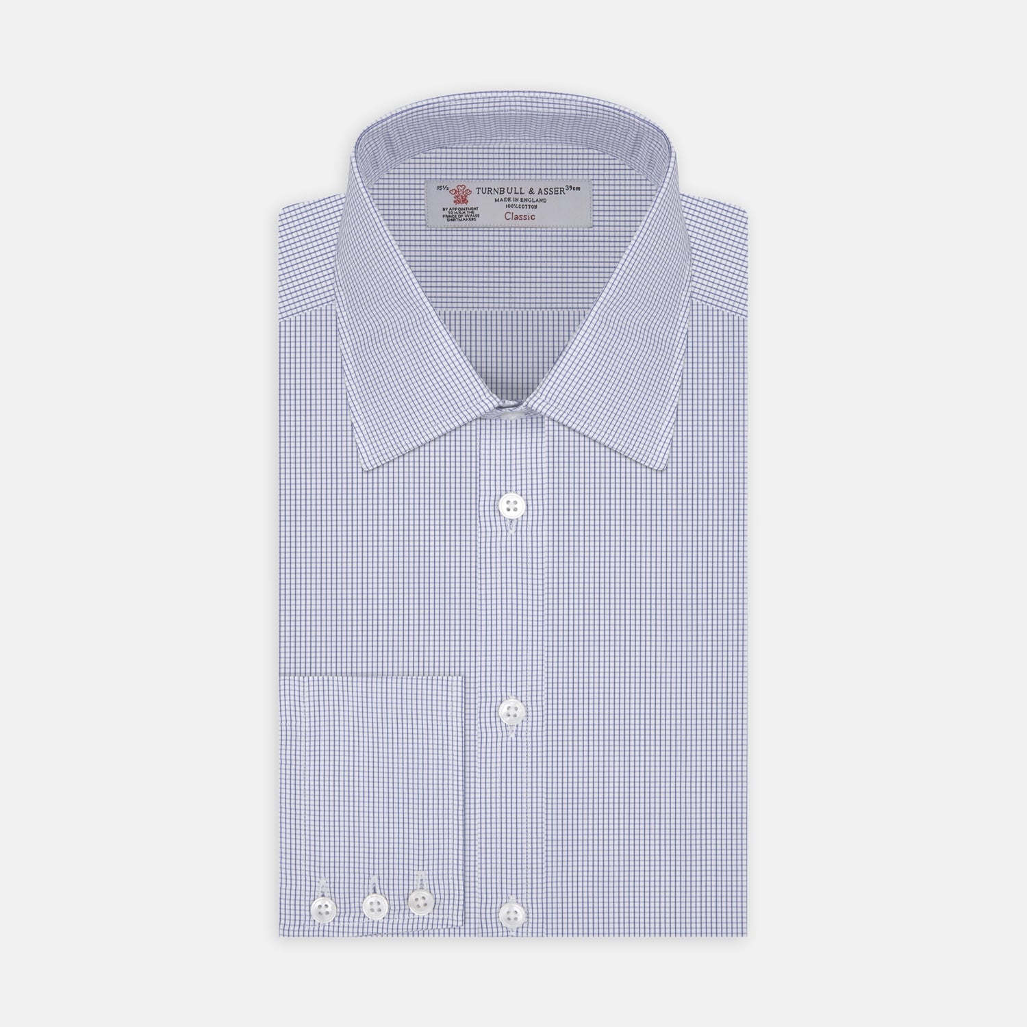Image 1 of product A neatly folded Turnbull & Asser Blue Grid Check Shirt features a T&A collar, 3-button cuffs, white buttons, and subtle British style. The blue and white check cotton design displays the brand label inside the collar.