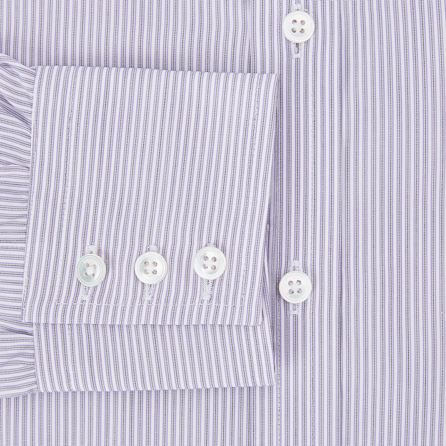 Image 4 of product The Lilac Halo Stripe Mayfair Shirt by Turnbull & Asser features a relaxed Mayfair fit, white buttons, a pointed collar, and a subtle lilac stripe pattern for timeless sophistication.