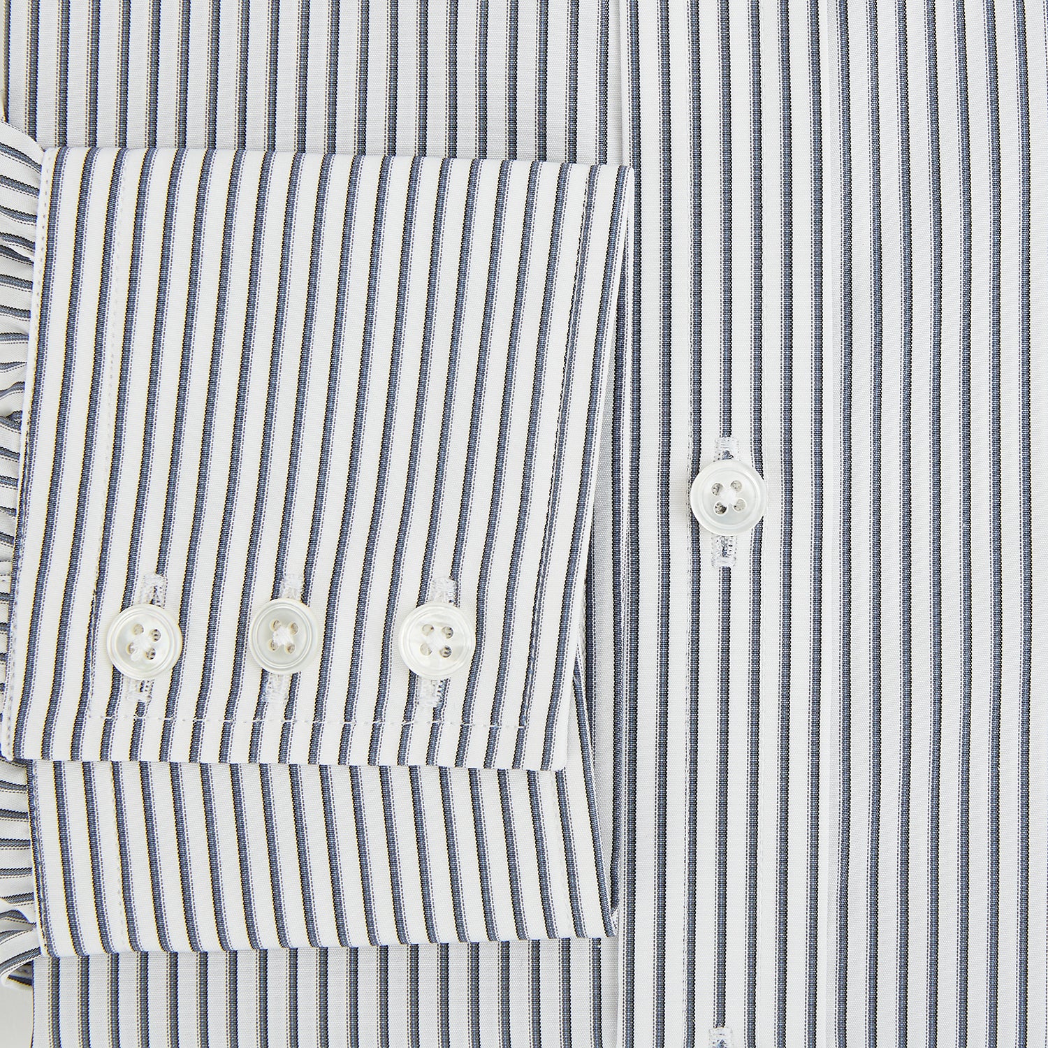 Image 4 of product The Turnbull & Asser Grey Multi Stripe Mayfair Shirt features long sleeves, a classic collar, and thin vertical stripes in black and white, shown laid flat on a white background.