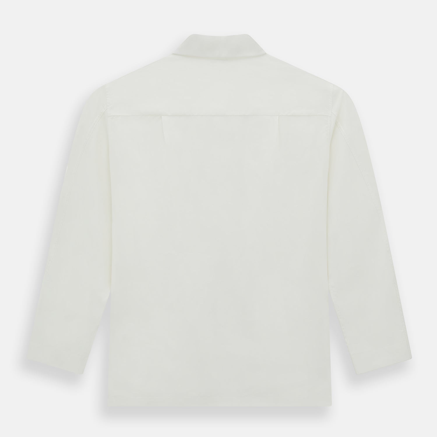 Image 5 of product The Turnbull & Asser Cream Silk Pyjama Set, shown laid flat on a white background, features a long-sleeve button-up top with a chest pocket and matching pants with an elastic drawstring waist—ideal for comfortable loungewear.