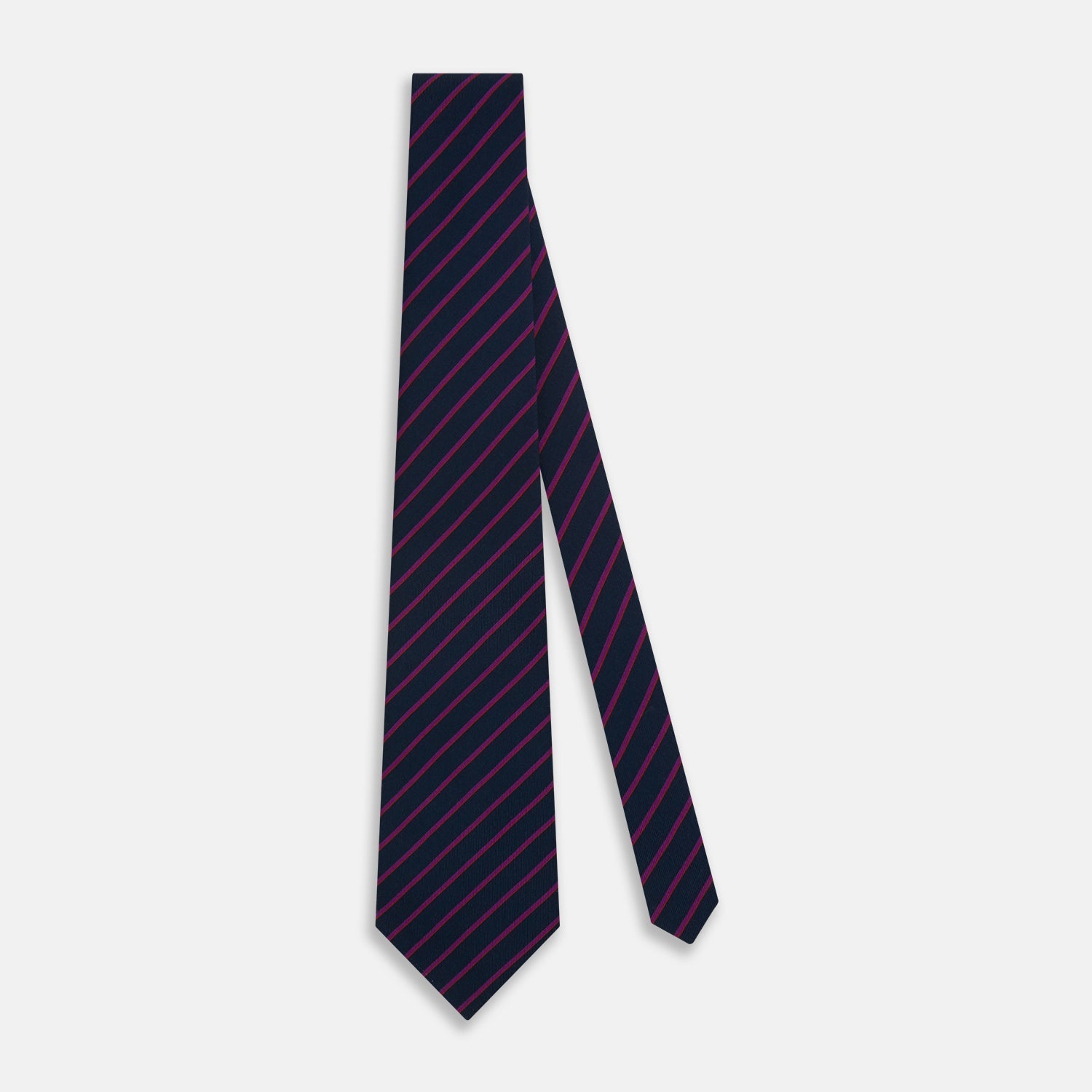 Image 2 of product The Turnbull & Asser Navy and Purple Striped Blazer Silk Tie features British craftsmanship with diagonal magenta and purple stripes, displayed neatly rolled on a white background.