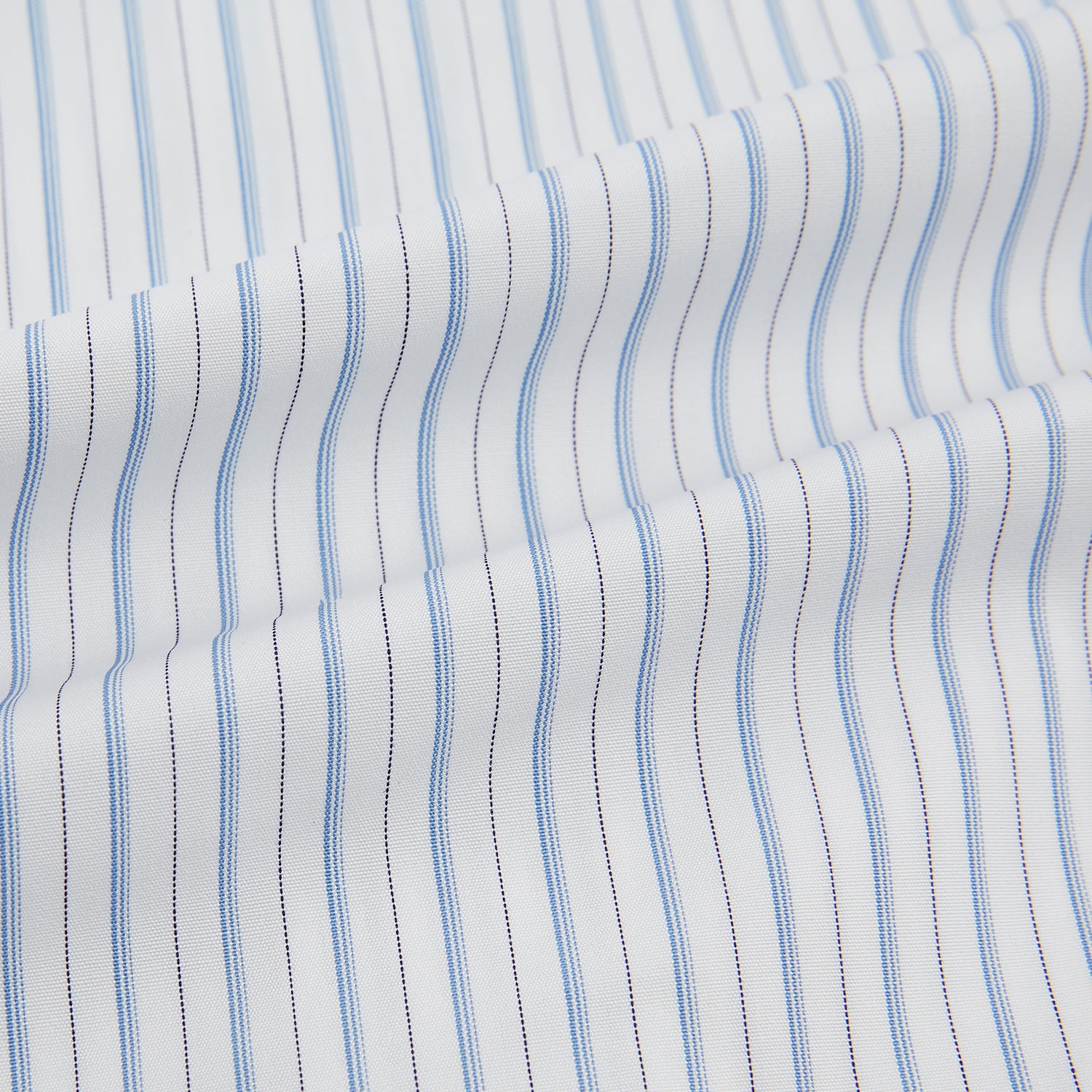 Image 6 of product The Turnbull & Asser Sky Blue Combination Stripe Mayfair Shirt features long sleeves, a T&A collar, buttoned cuffs, and thin vertical stripes in blue, shown on a plain white background.