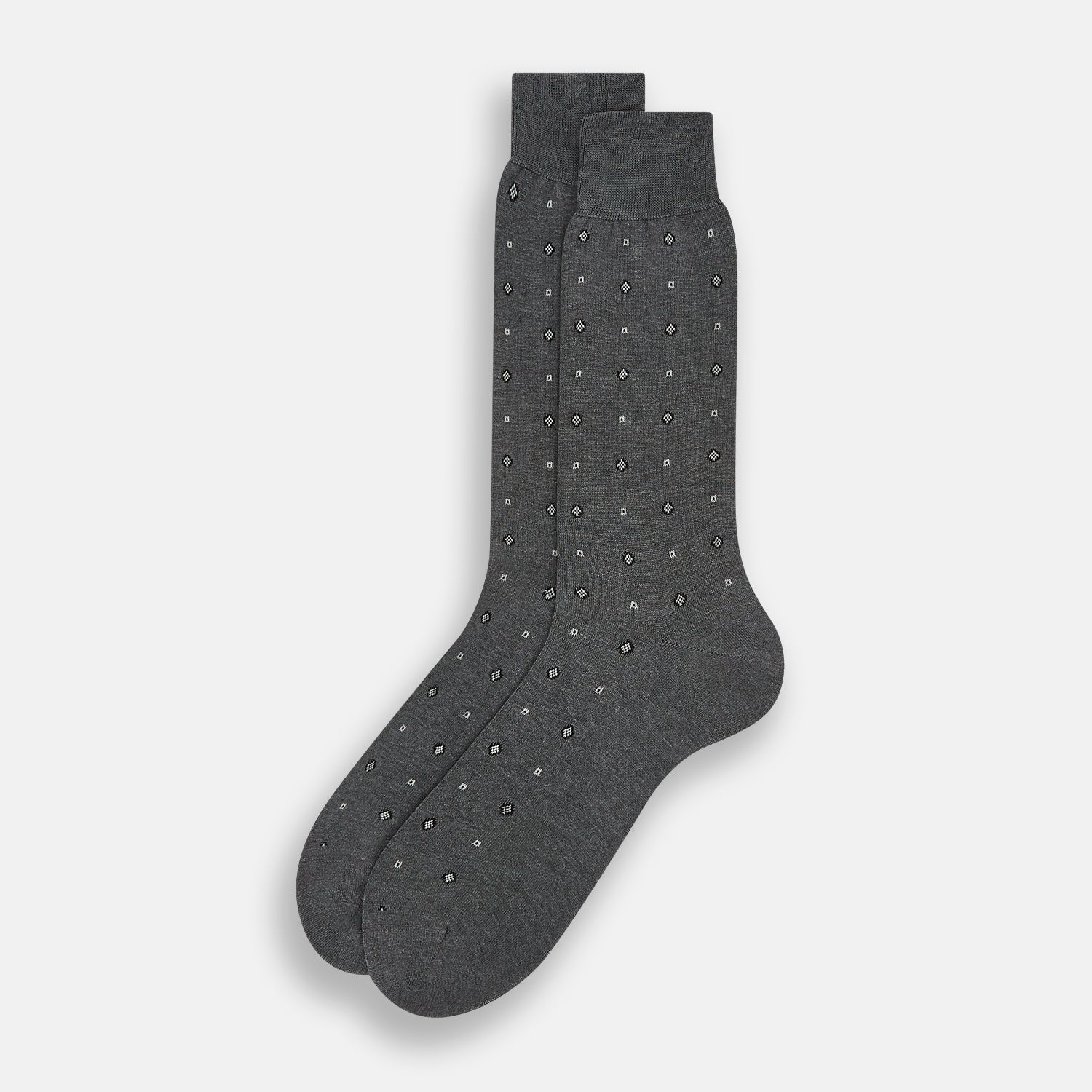 Image 2 of product The Grey Patterned Mid-Length Socks by Turnbull & Asser are crafted from soft Egyptian cotton, with a ribbed cuff and small white diamond shapes on a grey background.