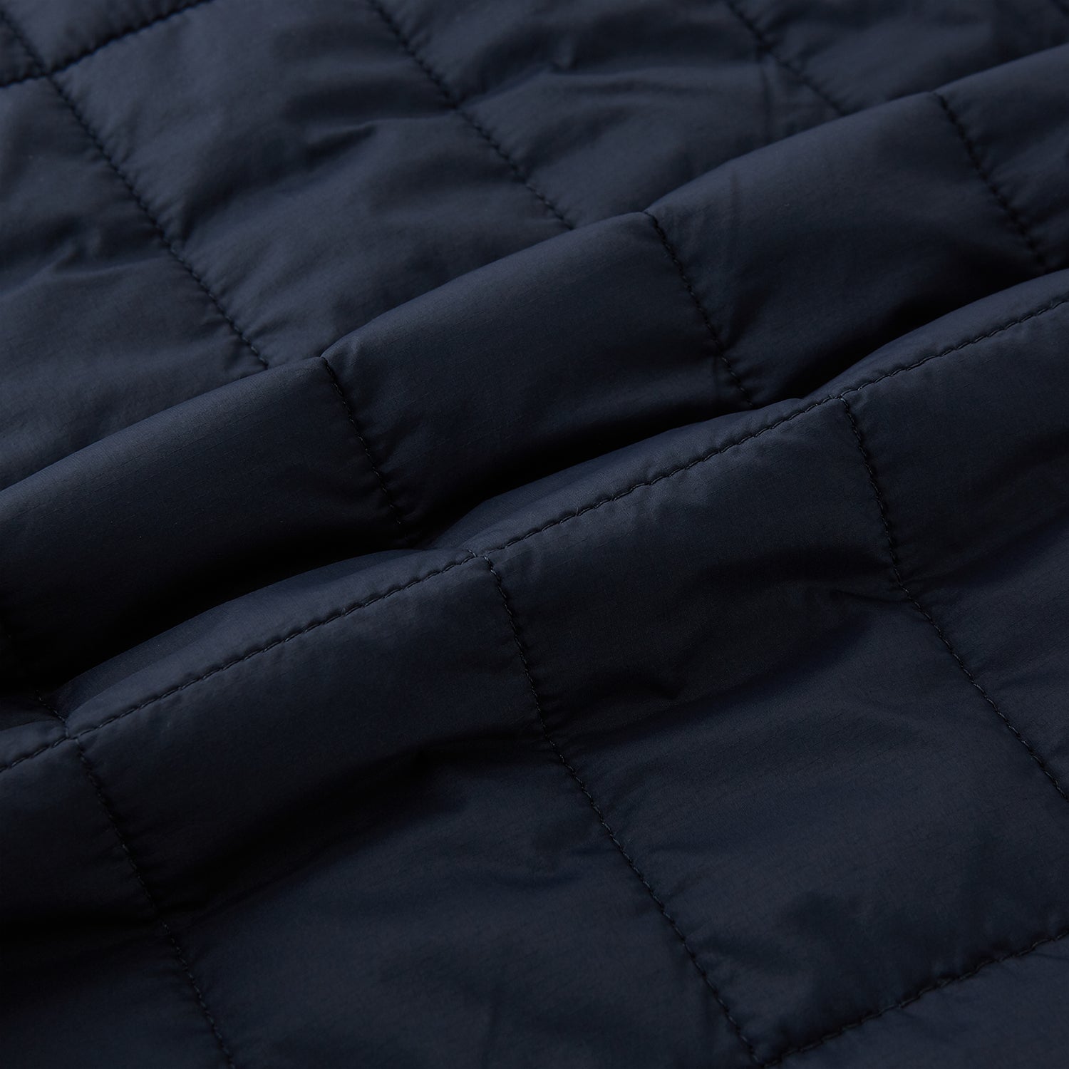 Image 4 of product The Turnbull & Asser Navy Quilted Gilet is sleeveless and lightweight, with a front zipper, zippered side pockets, chest pocket, and rounded hem—ideal for versatile layering. Shown on a plain white background.