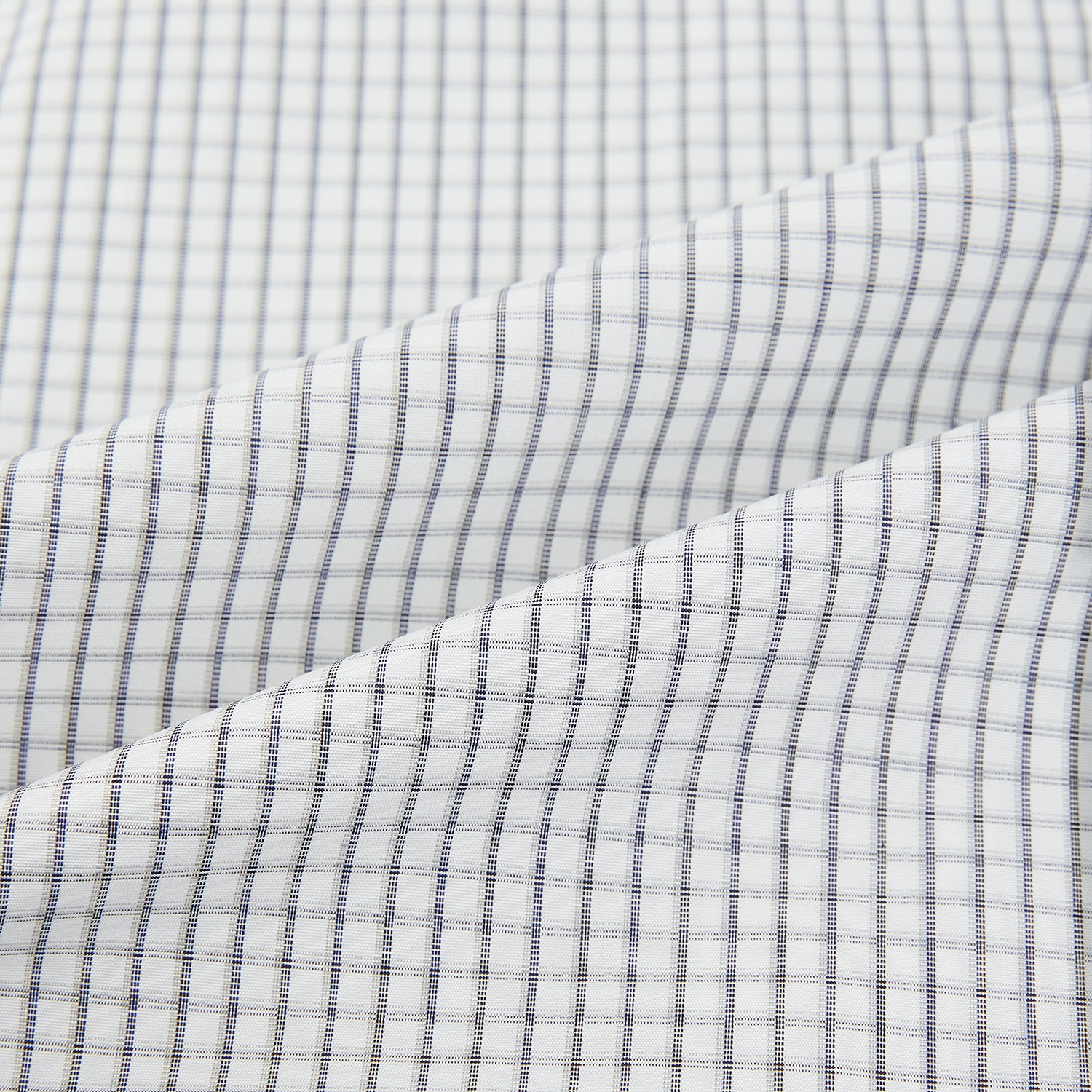 Image 6 of product The Midnight Blue Multi Check Mayfair Shirt by Turnbull & Asser is a pure cotton, long-sleeve button-down featuring a small blue multi-check pattern, pointed collar, and buttoned cuffs.