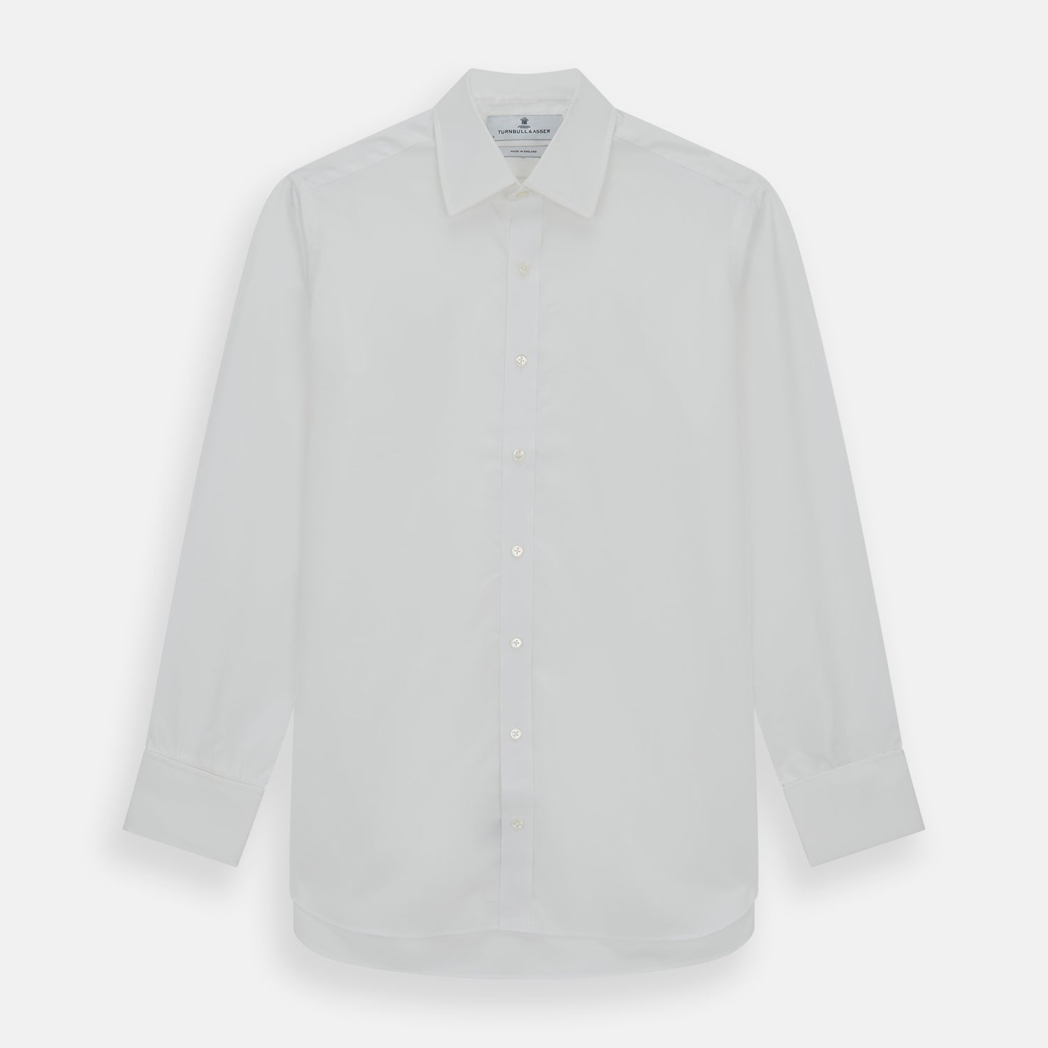 Image 1 of product The Turnbull & Asser Plain White Cotton Shirt features a T&A collar and double cuffs, shown flat on a white background—ideal for pairing with standout ties or achieving a minimalist look.