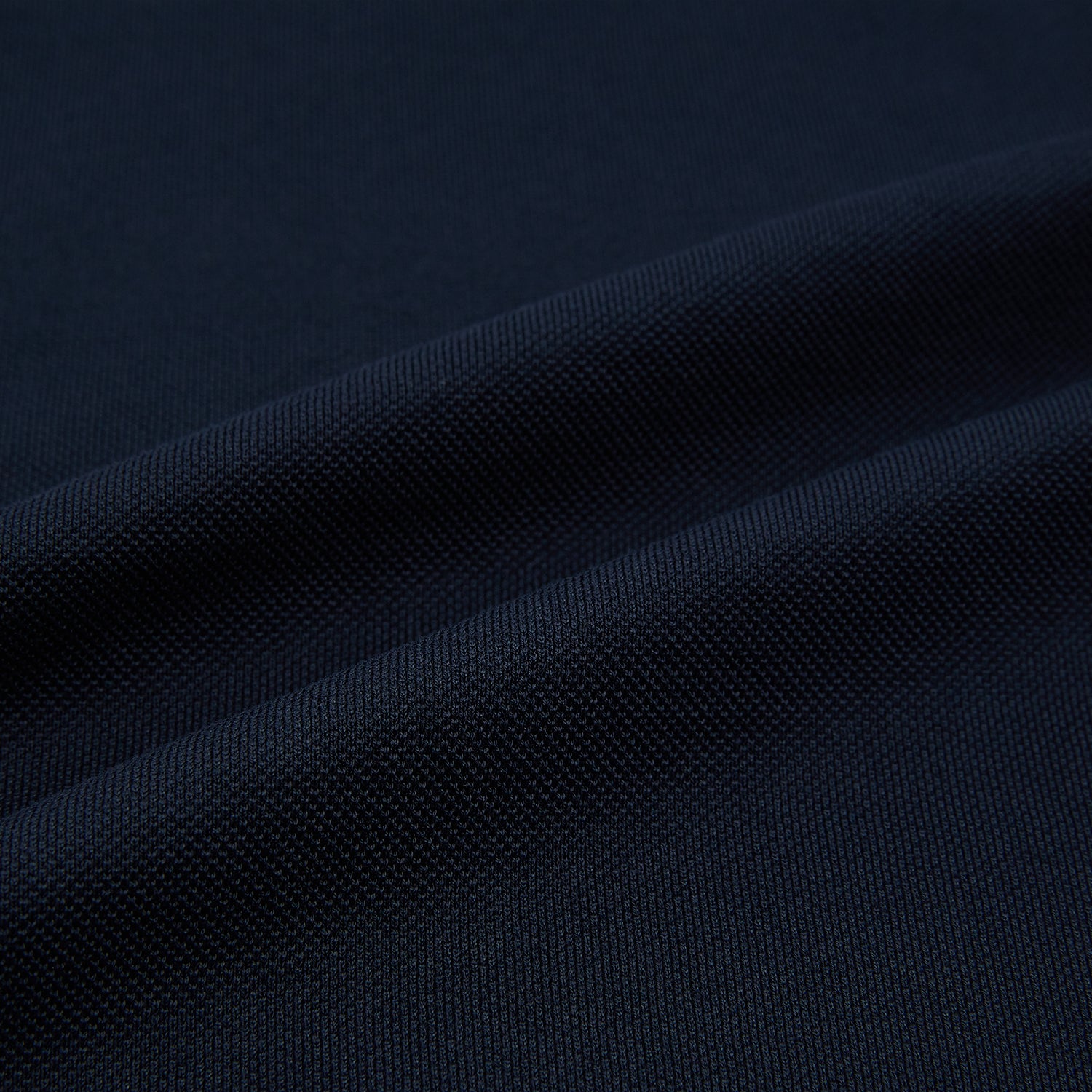 Image 6 of product A Navy Rugby Polo Shirt by Turnbull & Asser, featuring long sleeves and a collar, is displayed flat on a white background. The design is simple and free of visible logos or patterns.