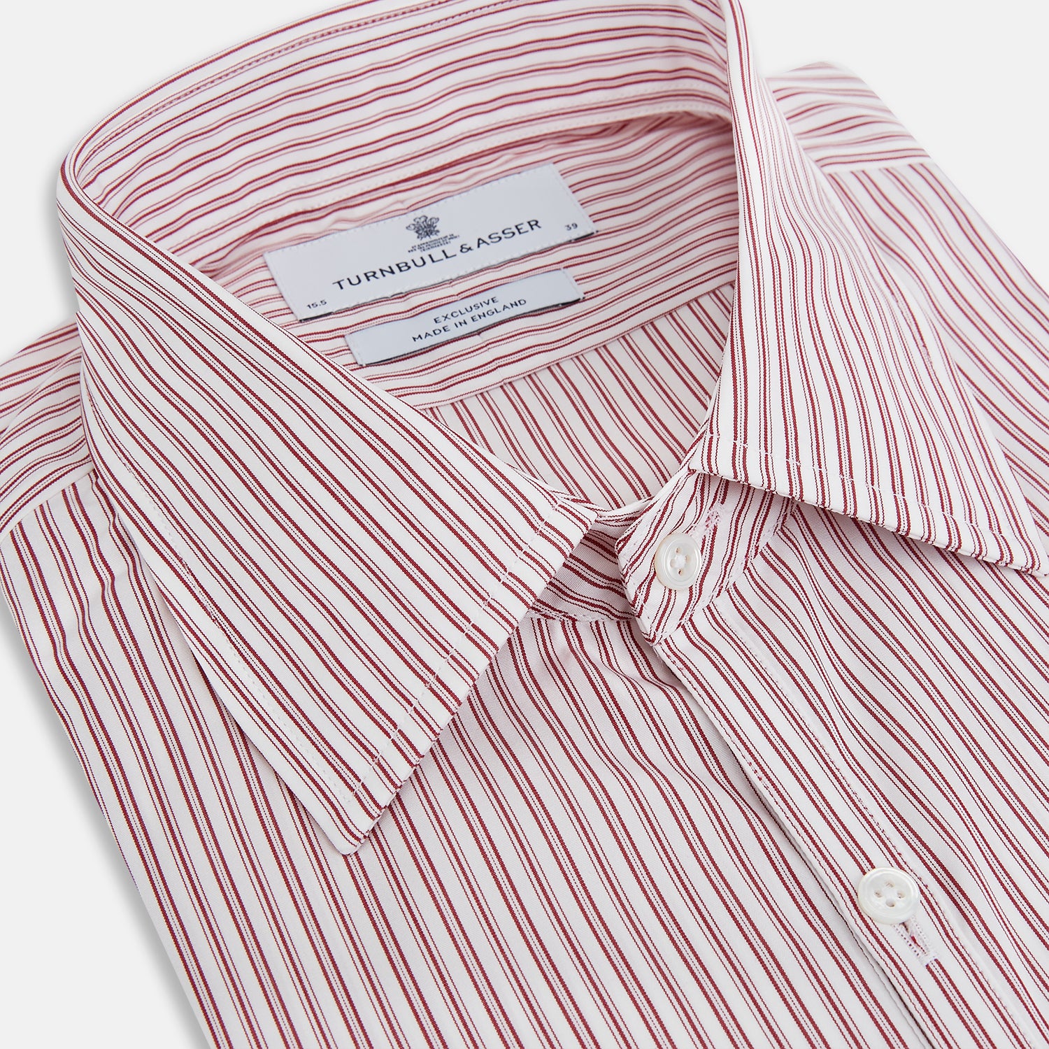 Image 2 of product The Red Ticking Stripe Westminster Shirt by Turnbull & Asser features long sleeves, a button-up front, and vertical red and white stripes, shown flat on a white background.