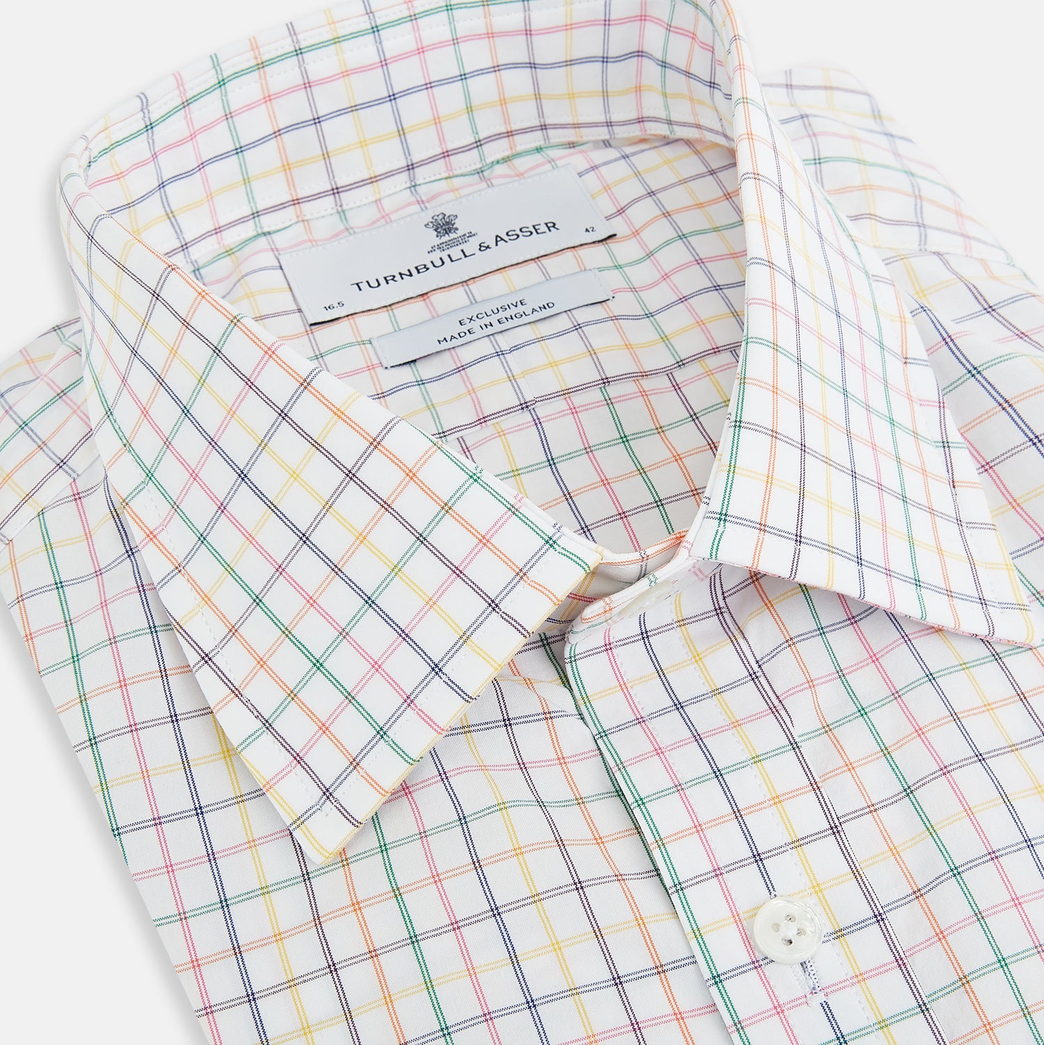 Image 2 of product The Rainbow Double Grid Check Mayfair Shirt by Turnbull & Asser features a white base with thin blue, red, and green checks and a T&A collar. It’s displayed neatly laid flat on a white background.