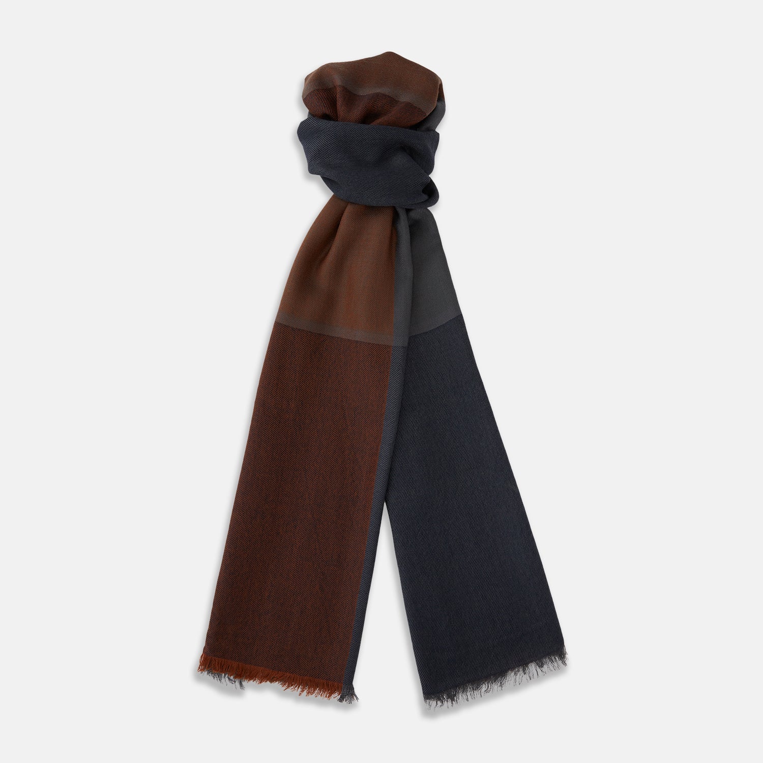 Image 1 of product The Turnbull & Asser Brown and Navy Cashmere Scarf features a long, rectangular shape, color block design, soft texture, and lightly frayed edges, elegantly folded on a plain white background.