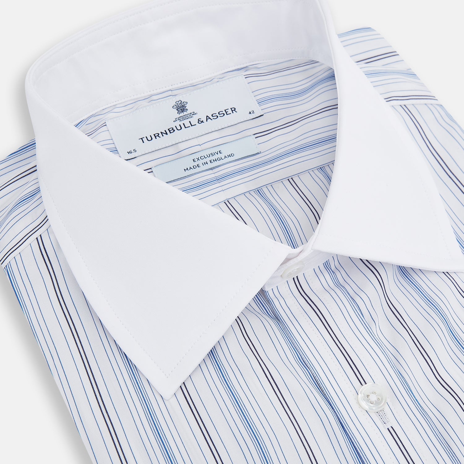 Image 2 of product The Turnbull & Asser Navy and Blue Multi Stripe Shirt with Contrast Collar and Double Cuffs is shown in a Mayfair fit on a plain white background.