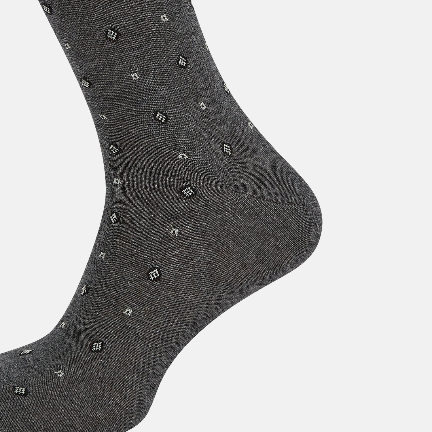 Image 4 of product The Grey Patterned Mid-Length Socks by Turnbull & Asser are crafted from soft Egyptian cotton, with a ribbed cuff and small white diamond shapes on a grey background.