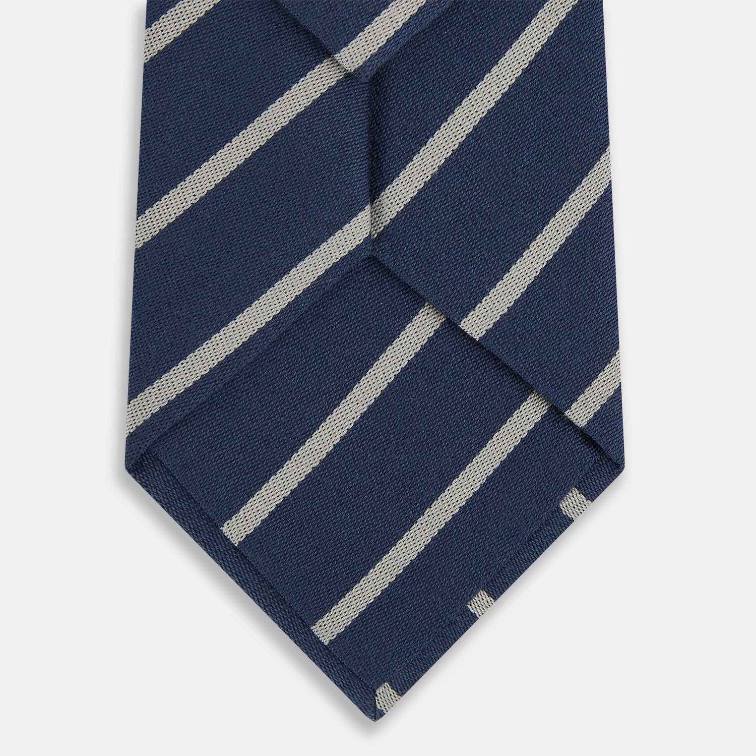 Image 3 of product The Turnbull & Asser Navy Block Stripe Silk Blend Tie features navy and cream stripes with diagonal light gray accents, displayed against a plain white background.