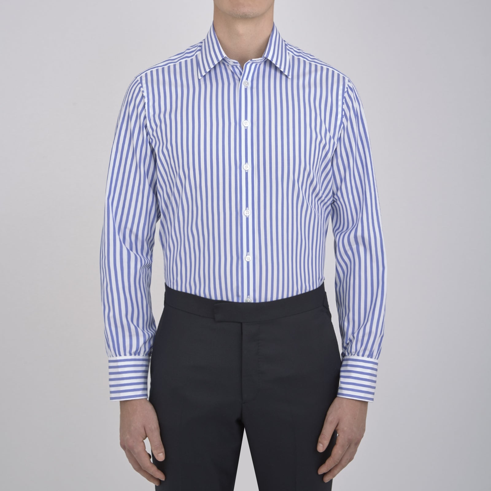 Image 4 of product The Turnbull & Asser Blue and White Candy Stripe Shirt features a T&A collar and 3-button cuffs, shown neatly folded on a plain white background.